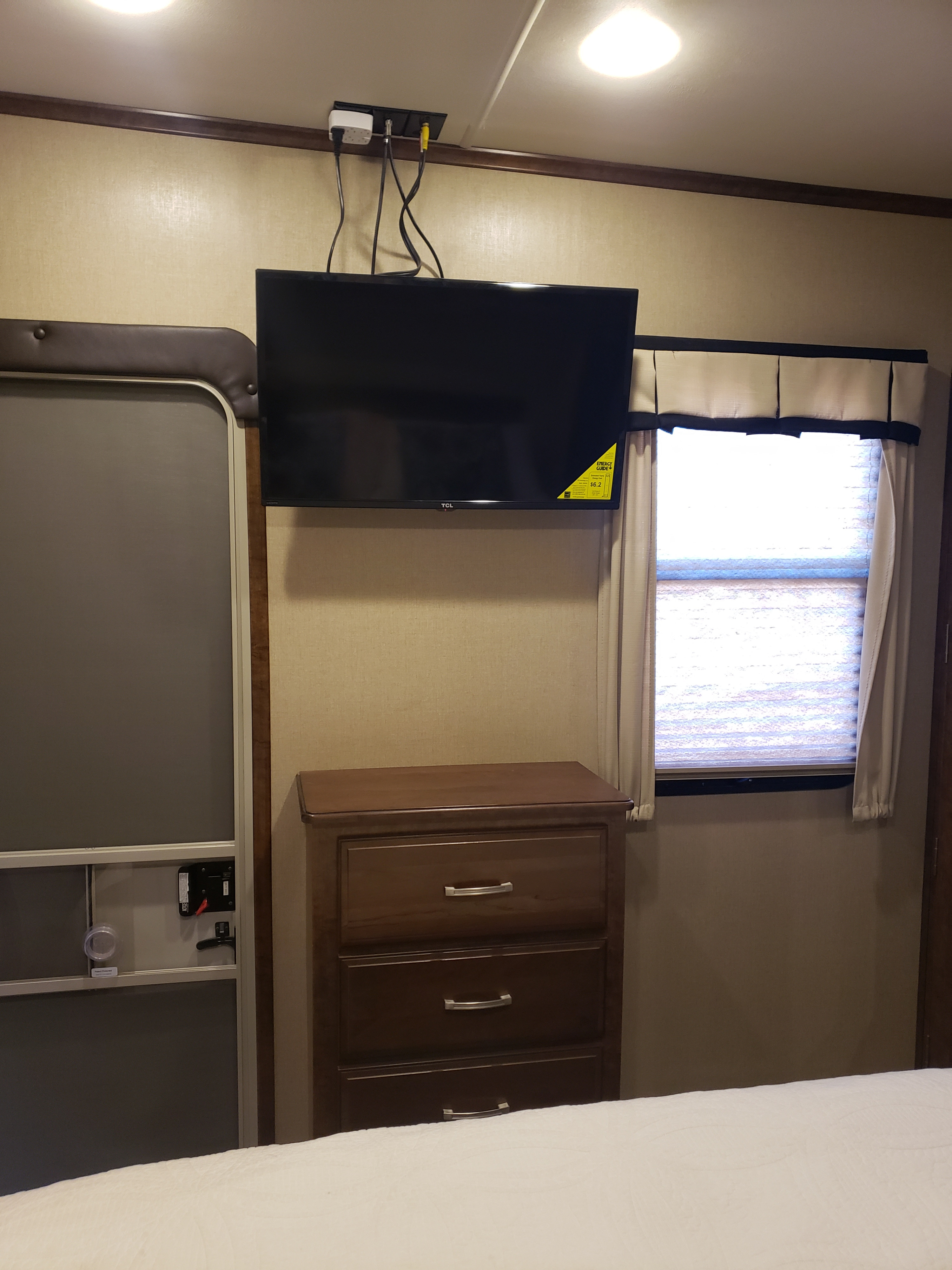 Television Mounted in Bedroom. Grand Design Solitude 2016