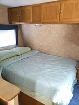 Comfortable full size bedroom for 2 with plenty of storage space. Dutchmen Sport 2004