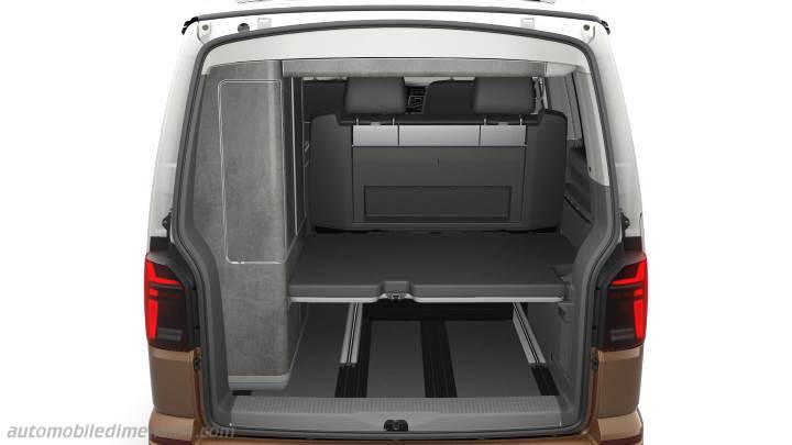 Explore RV rental options: Rear view of a camper van's flexible interior with fold-down bed & modular storage.. VW California T6 .1 2021 model Year Ocean 2021