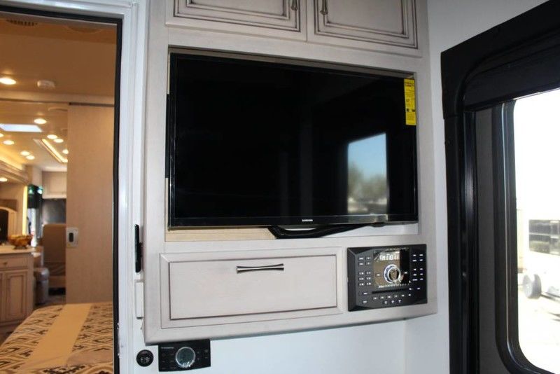 TV and stereo in back bedroom area of Toy Hauler. Newmar Canyon Star 2020