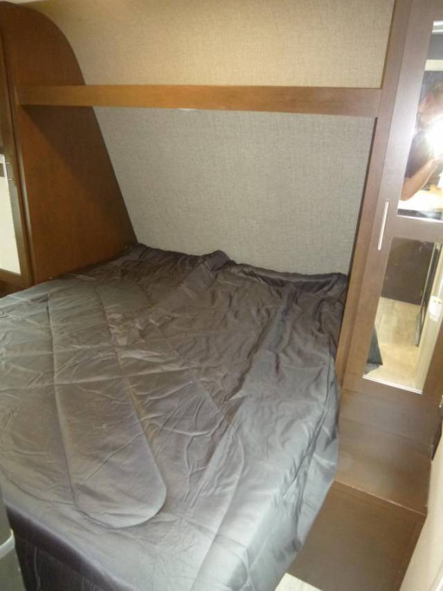 Master bed features a queen bed with side closets and night stand on both sides. Shut the doors for privacy away from the rest of the camper. . K-Z Manufacturing Sportsmen 2019