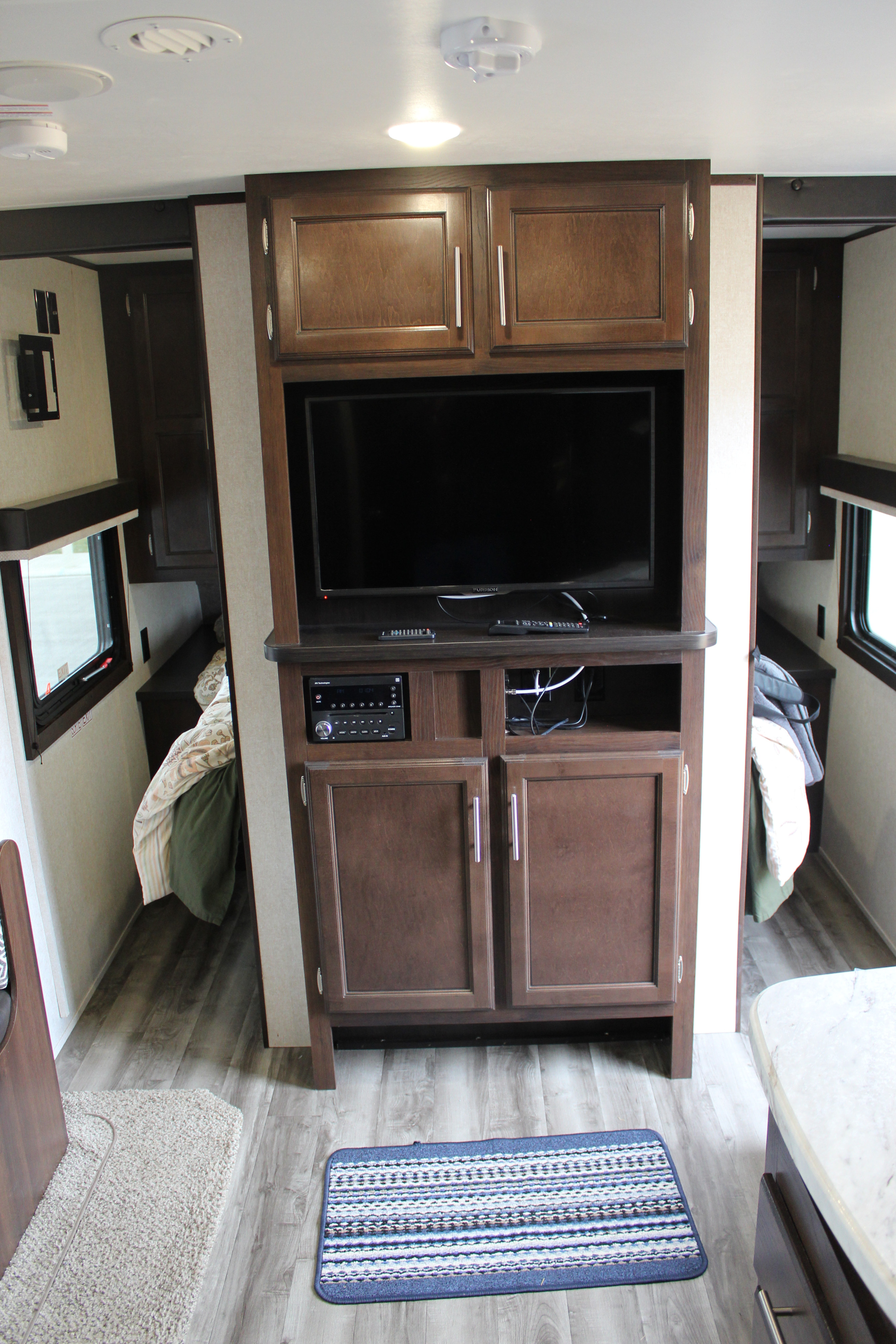 RV rental: Cozy interior featuring entertainment center with TV/stereo, and two private bedrooms.. Jayco Jay Flight SLX Rocky Mtn Edition 2019
