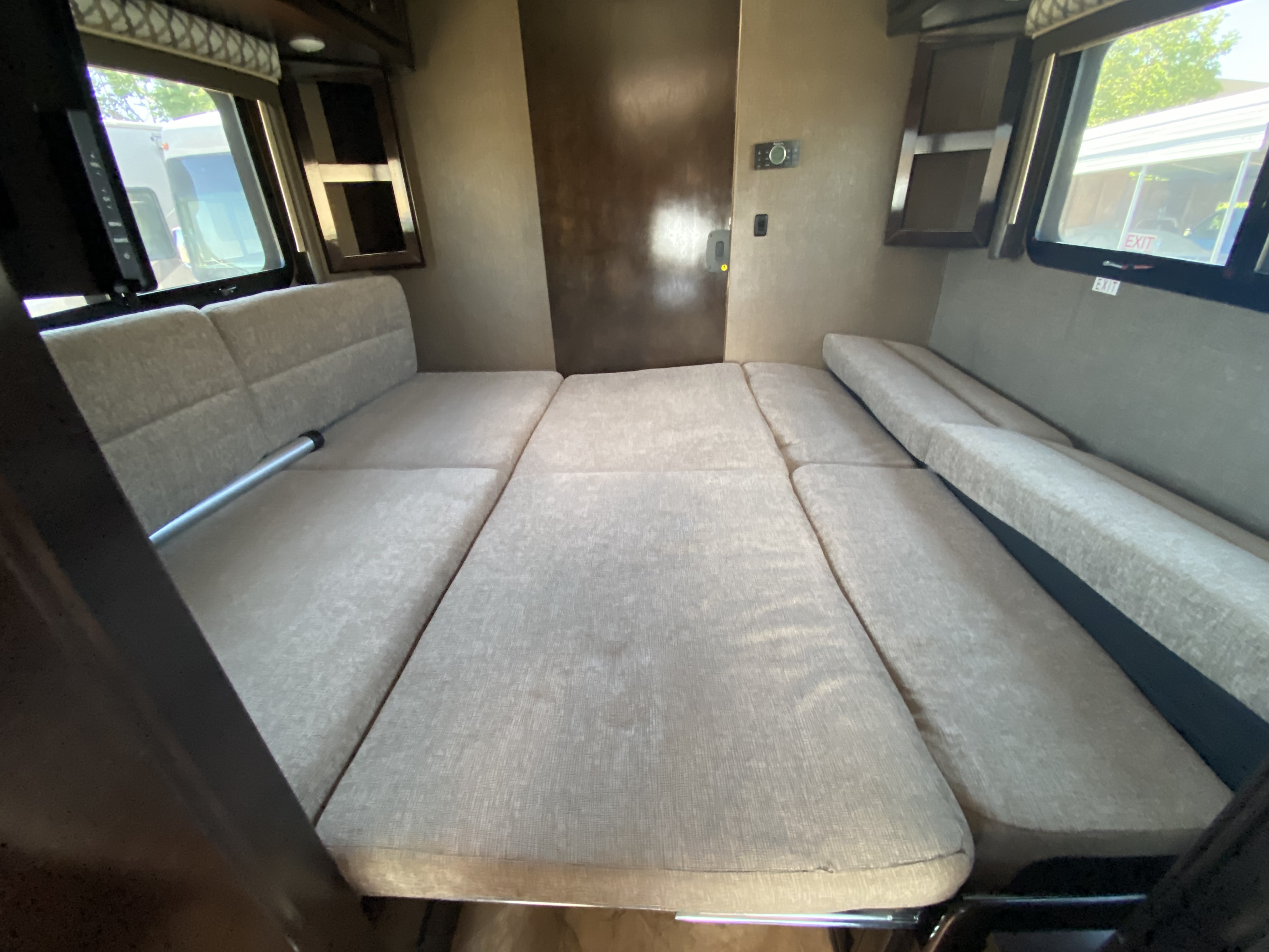 This RV rental features a versatile dinette, easily converting into a spacious, comfortable bed with plush cushions for sleeping.. Thor Motor Coach Citation 2018