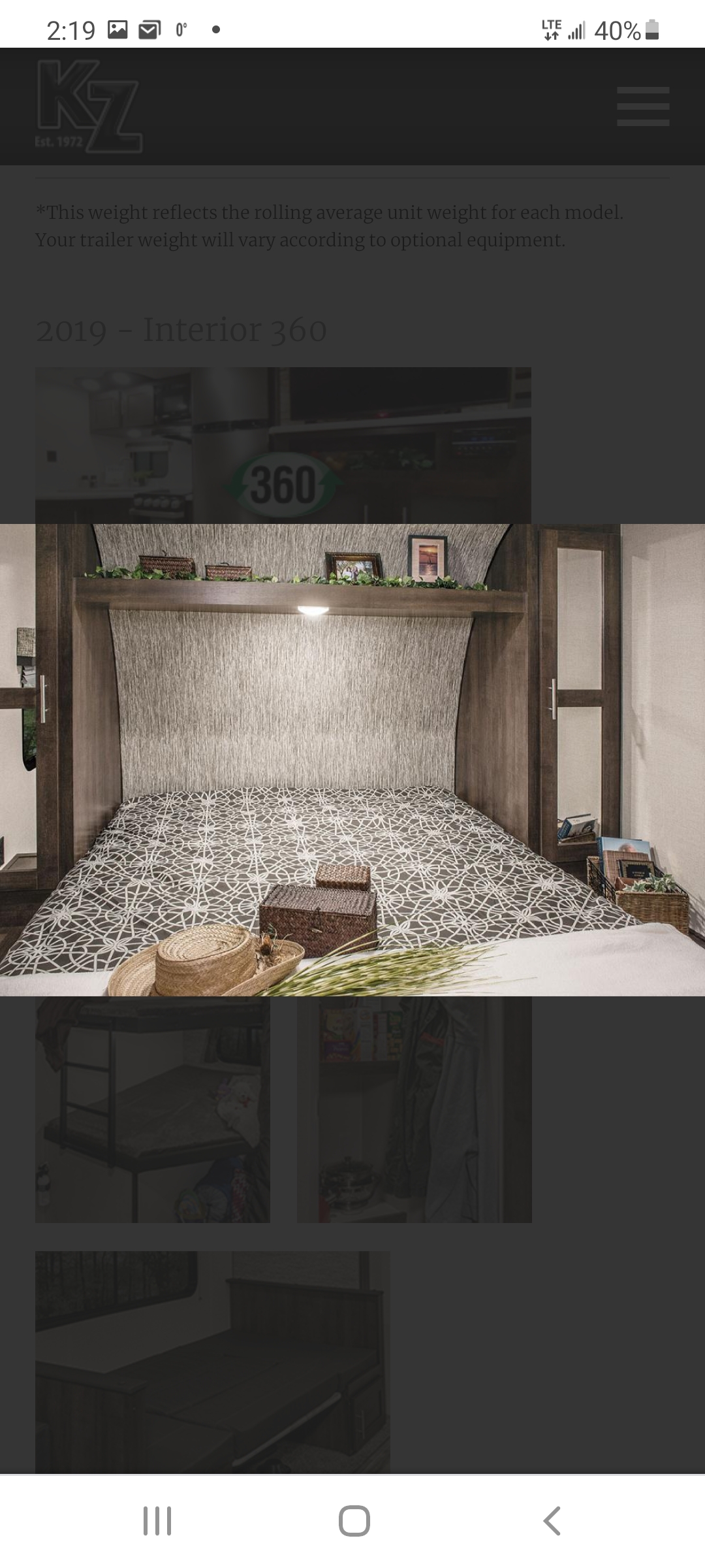 Detailed view of an RV rental bedroom interior from a 2019 model, highlighting the bed, overhead shelf, and built-in storage. Ideal for travel trailer enthusiasts.. Other Sportsmen 2019