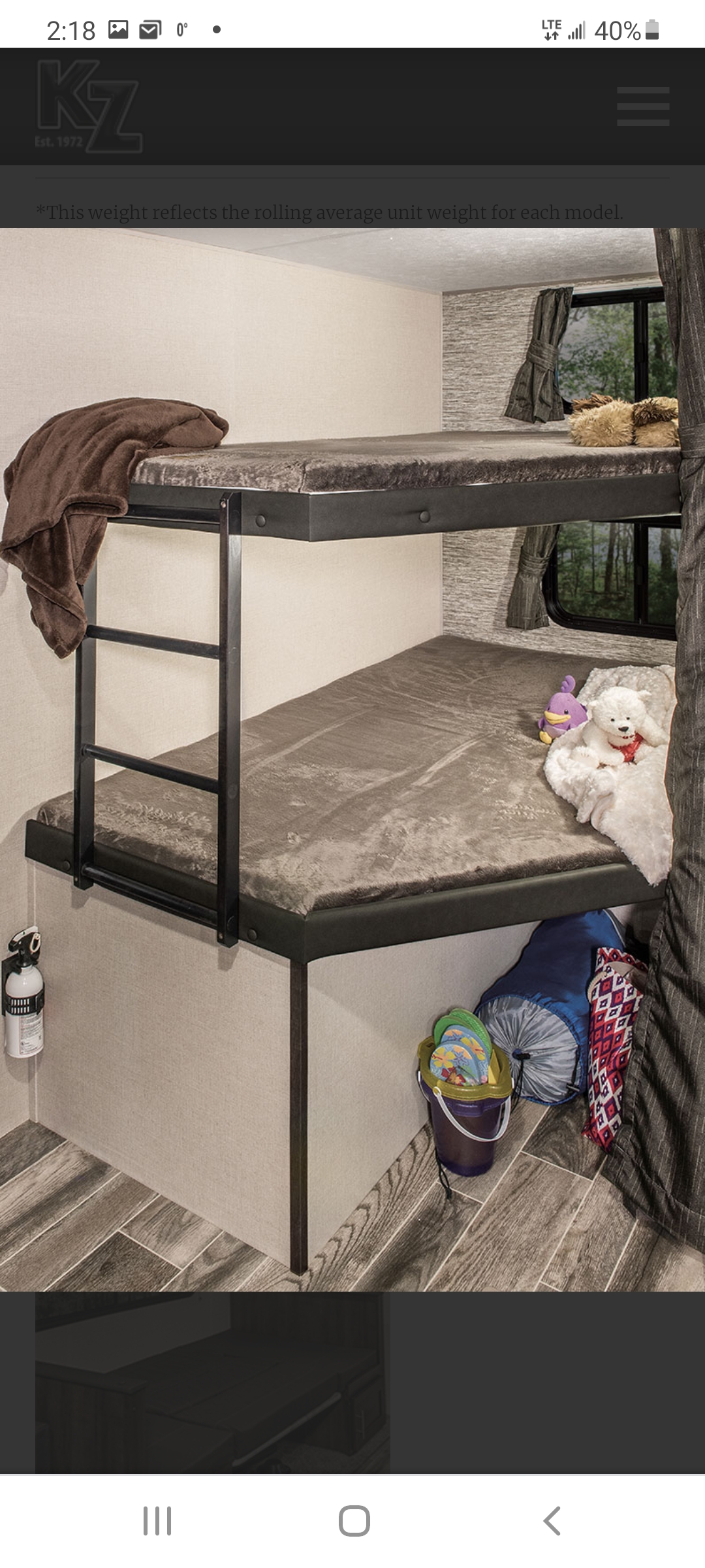 Inside an RV rental: comfortable bunk beds with ladder, perfect for family camping trips in this cozy travel trailer.. Other Sportsmen 2019