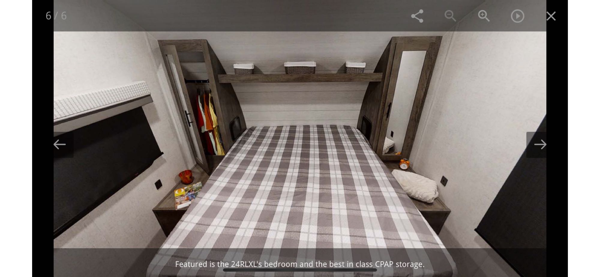 Explore this RV rental's 24RLXL bedroom, featuring smart built-in storage and CPAP-friendly spaces for your comfort.. Forest River Wildwood X-Lite 2021