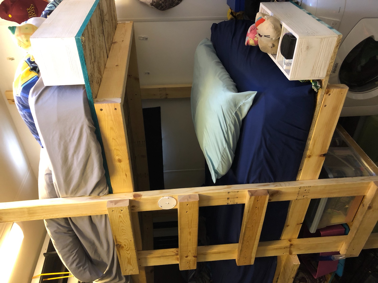 Robust, custom wooden bunk beds in a compact RV rental. Features stacked mattresses, cozy bedding, and efficient space use.. Newmar Canyon Star 2015