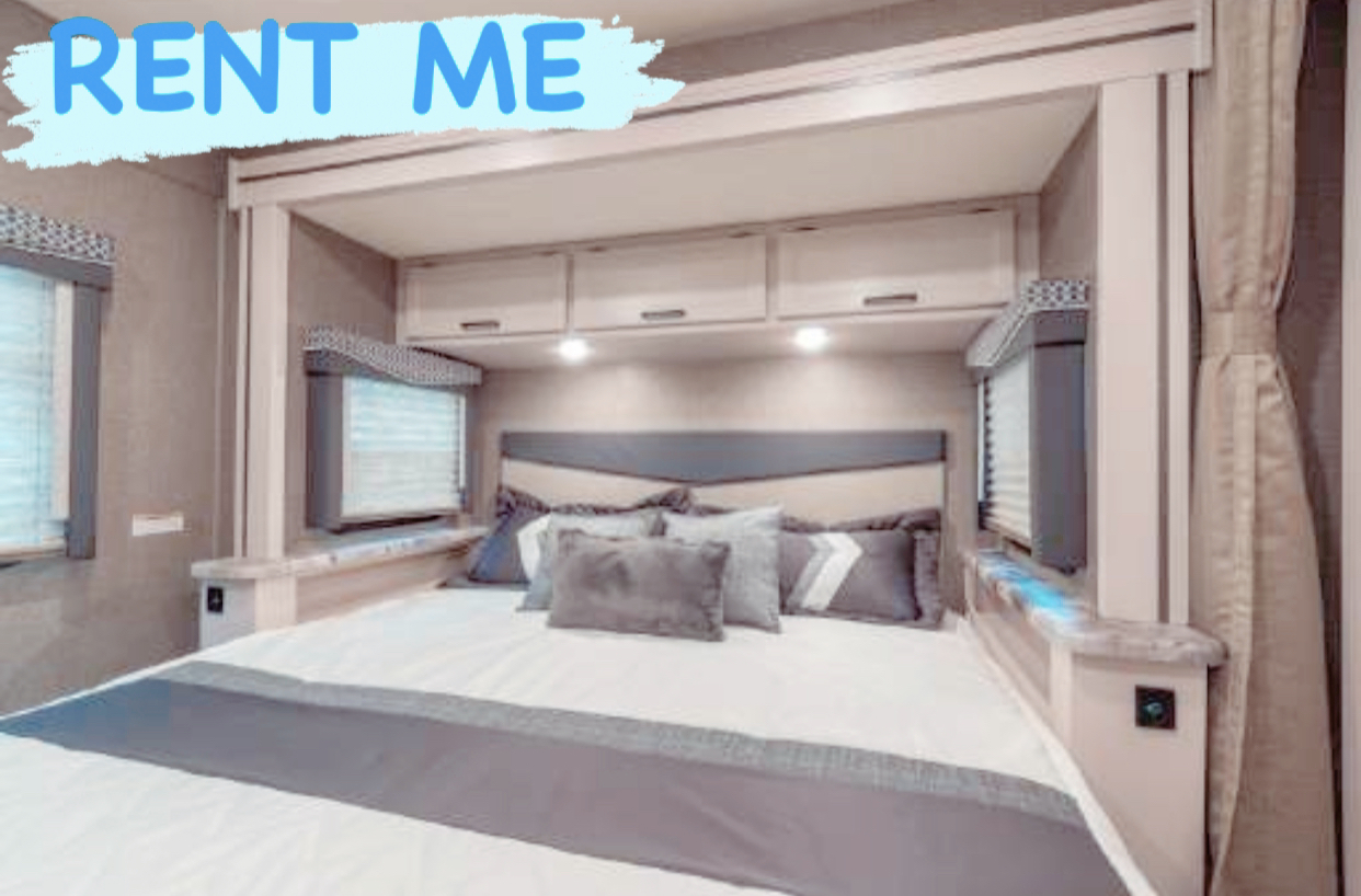 Experience comfort on wheels with this spacious RV rental! Modern bedroom interior with plush bedding, perfect for your next adventure.. Other A.C.E 2021