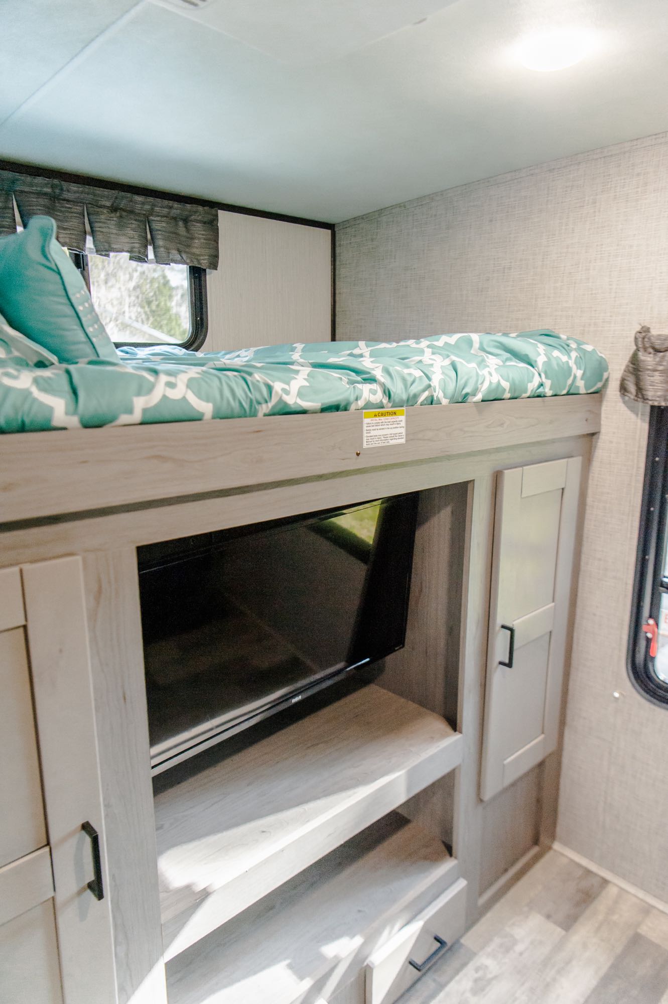 Bunk House has two bunks, covertible couch, and a tv with DVD player.  This bunk has a weight limit of 300 lbs.. Heartland Mallard 2020