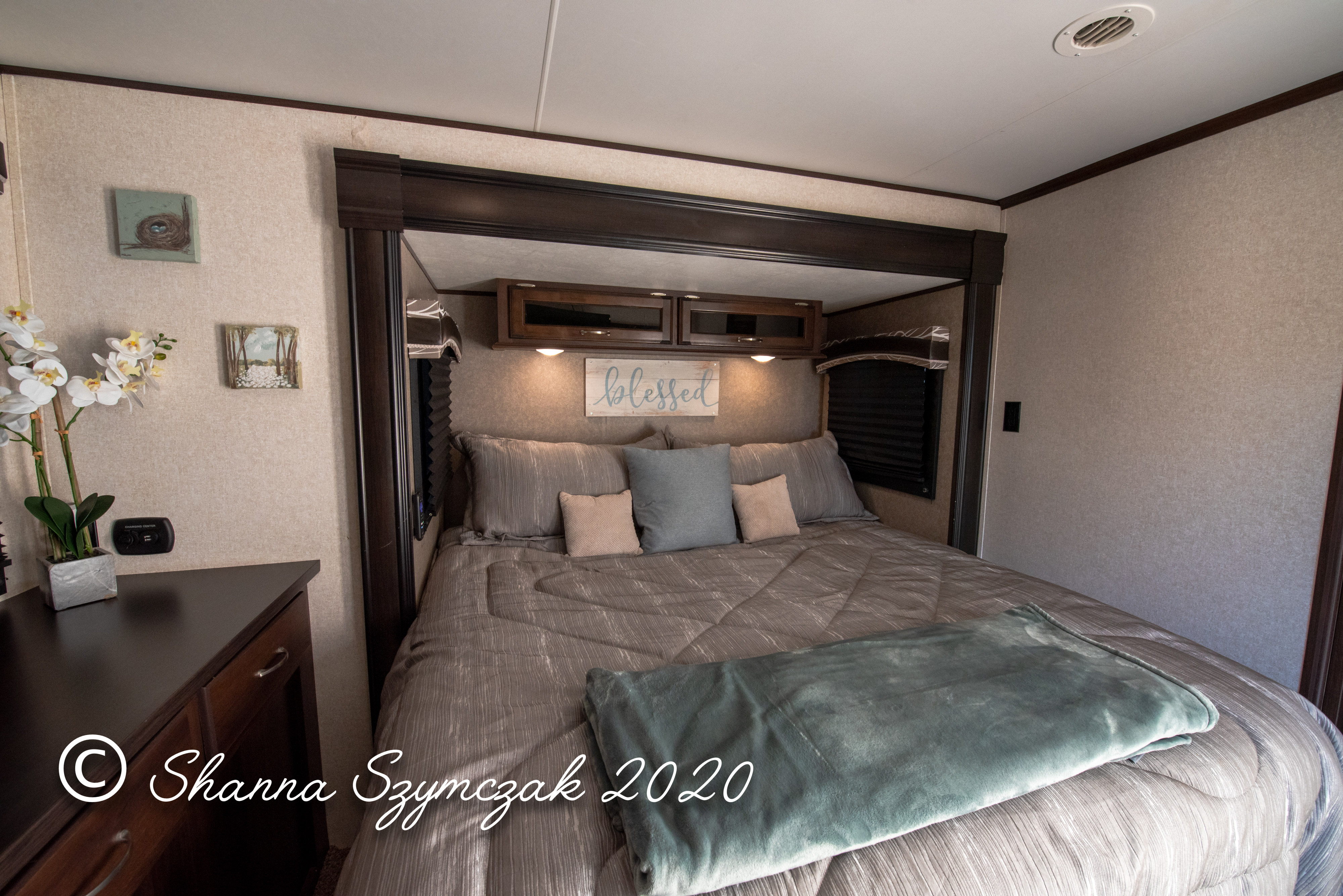 Cozy RV rental bedroom with modern decor, comfortable bed, and built-in amenities.. Jayco Jay Flight 2018