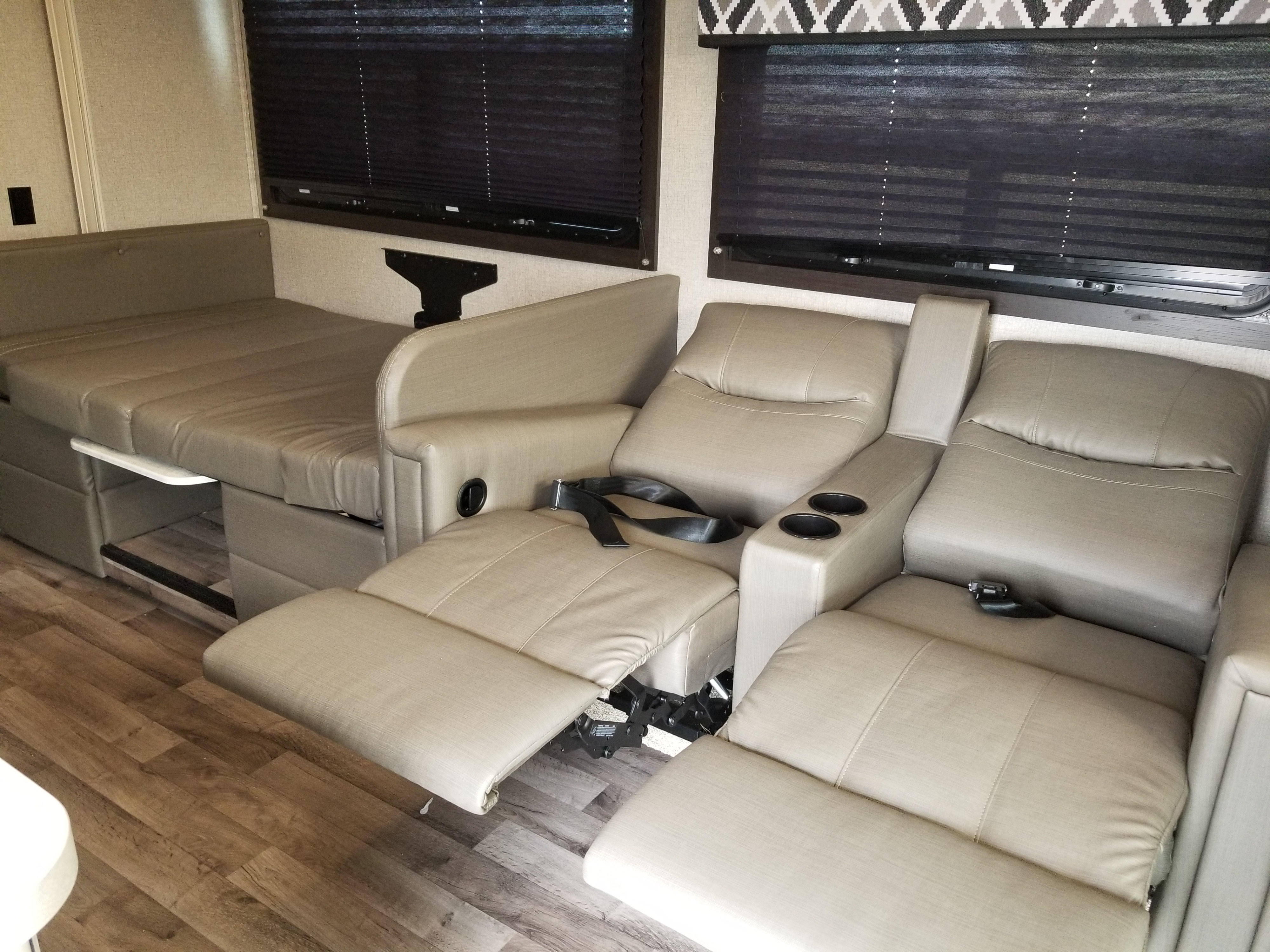 Experience comfort in this rv rental. Features include light-colored convertible bench seating, a slide-out table, and plush recliners.. Entegra Coach Other 2021