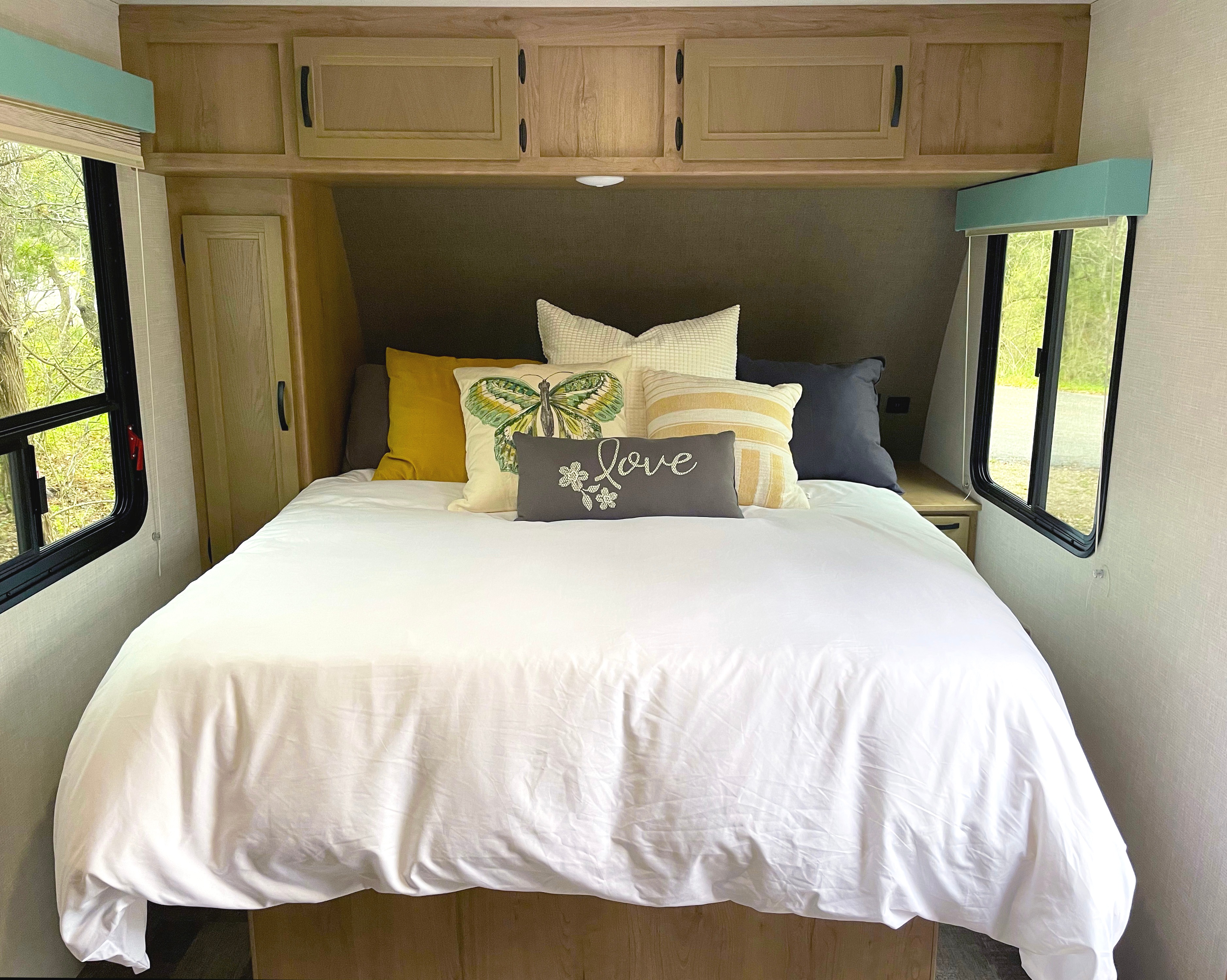 Comfortable Queen bed with memory foam mattress topper.. Winnebago Micro Minnie 2021