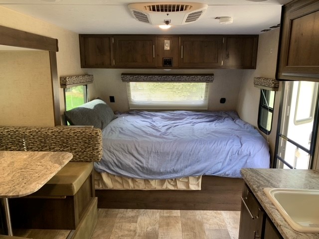 Queen bed in front, many windows, storage cabinets above; shoe storage below, a/c on ceiling. Other Other 2018