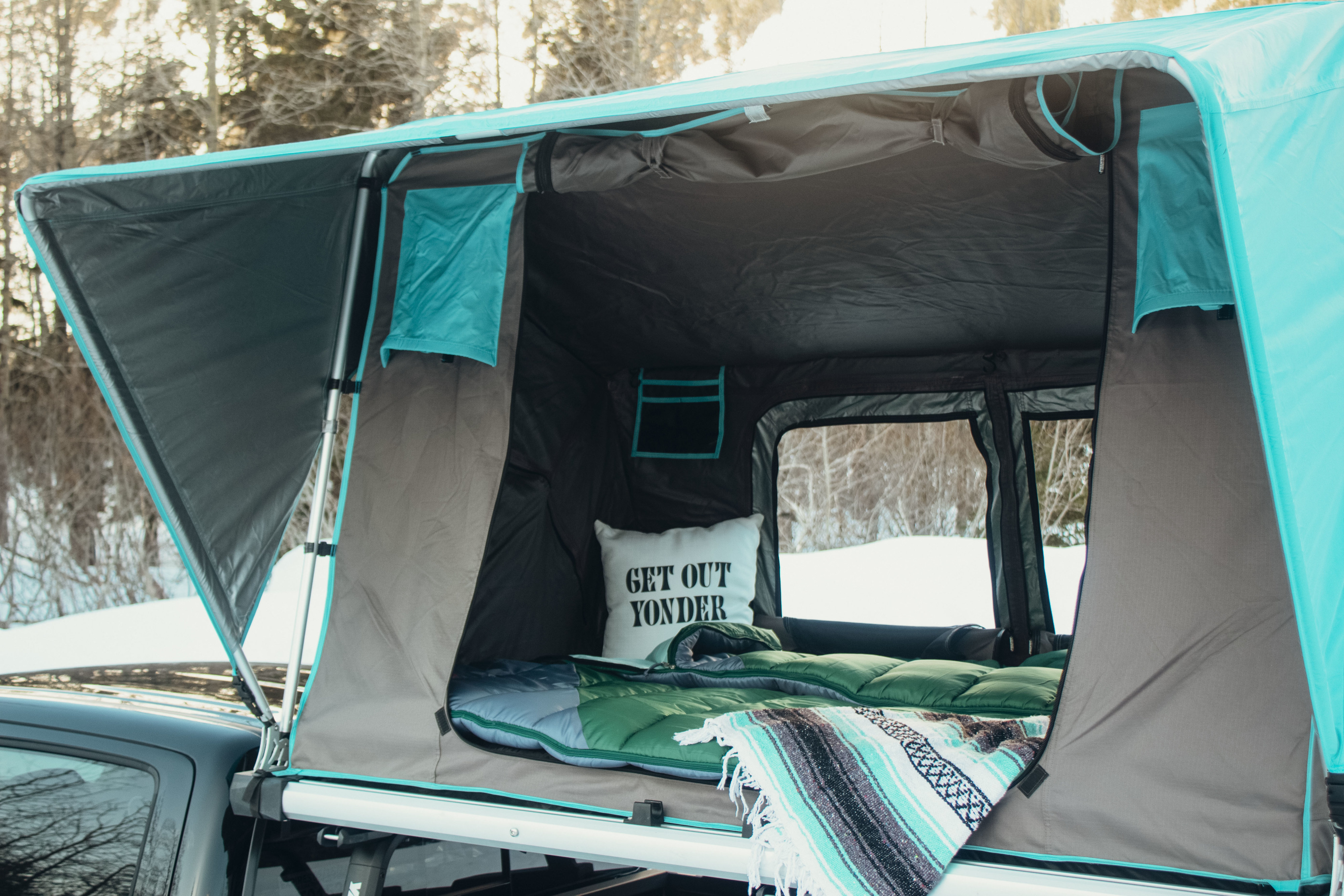 Get ready for adventure! This cozy rooftop tent on a truck offers an ideal **RV rental** experience for winter travels.. Toyota Tacoma 2021