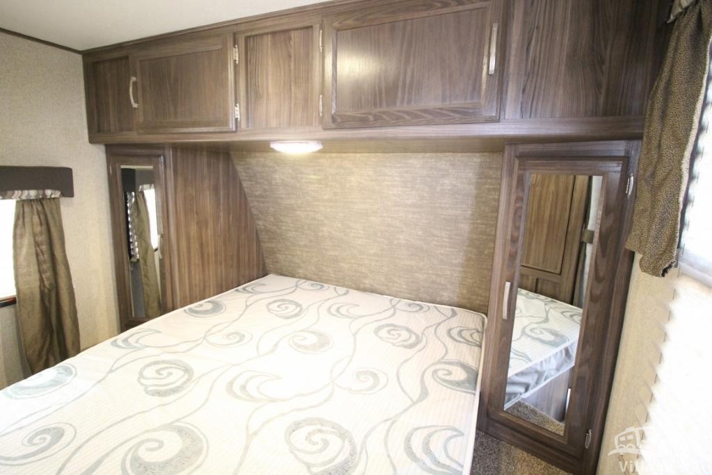 RV rental bedroom view: cozy sleeping area with overhead cabinets & mirrored closets, perfect for your mobile adventures.. Coachmen Other 2019