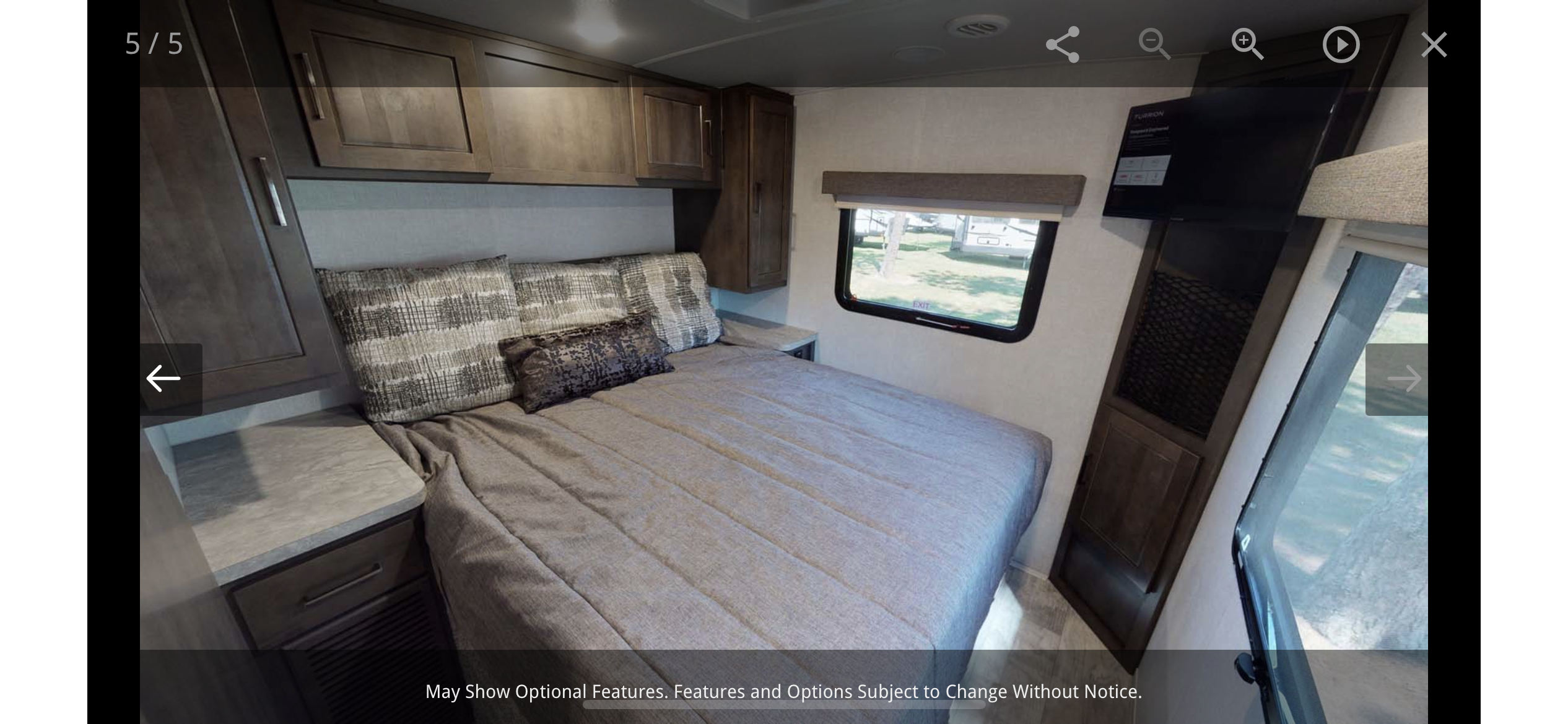 RV rental bedroom interior, featuring a cozy bed, window, and TV for comfortable travel.. Forest River Rockwood Mini Lite 2019