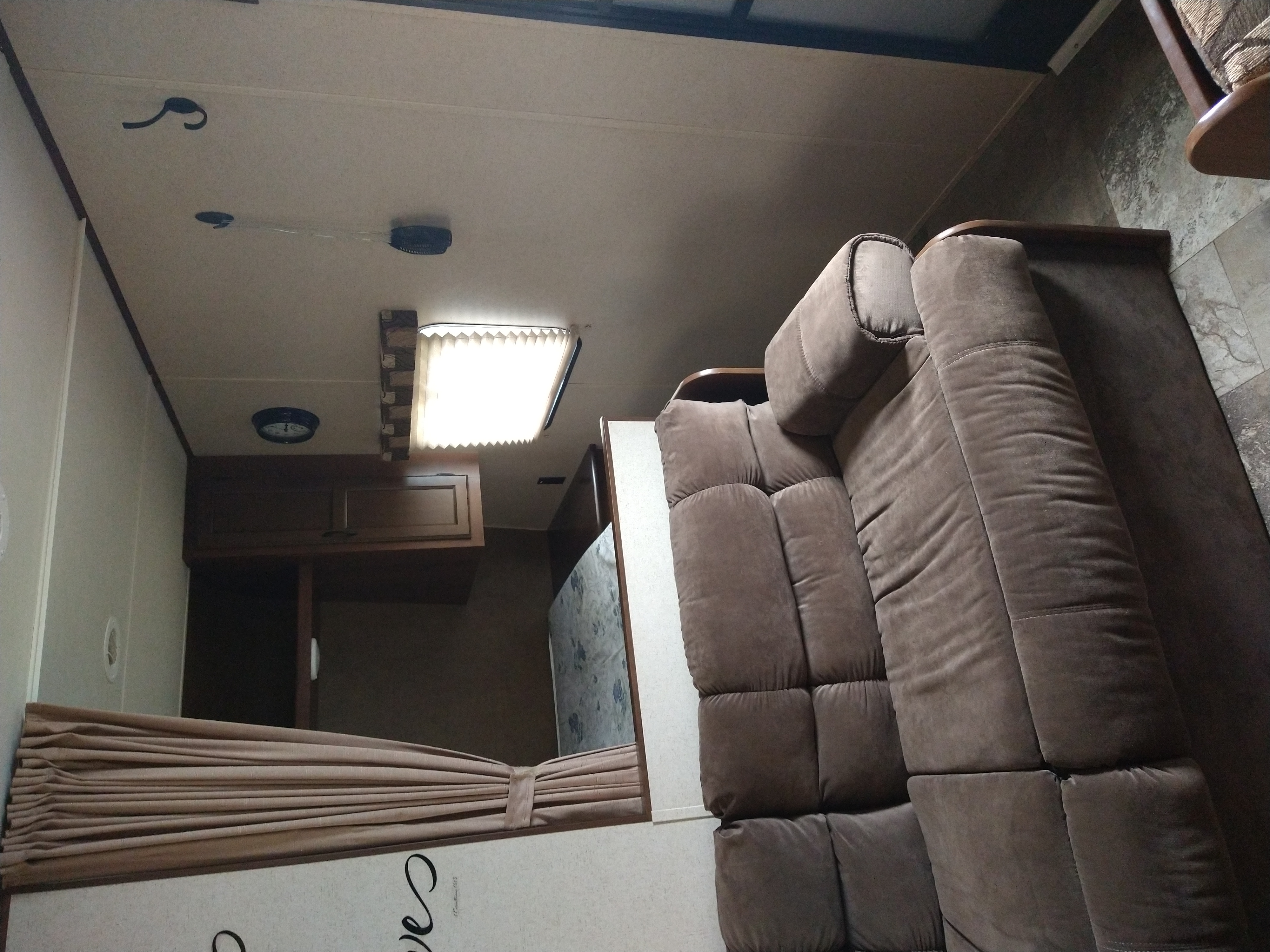 Cozy RV rental interior: view of a comfortable brown sofa, bright ceiling light, and bunk bed area. Ideal for travel.. Jayco Jay Flight Slx 264 BHW 2015