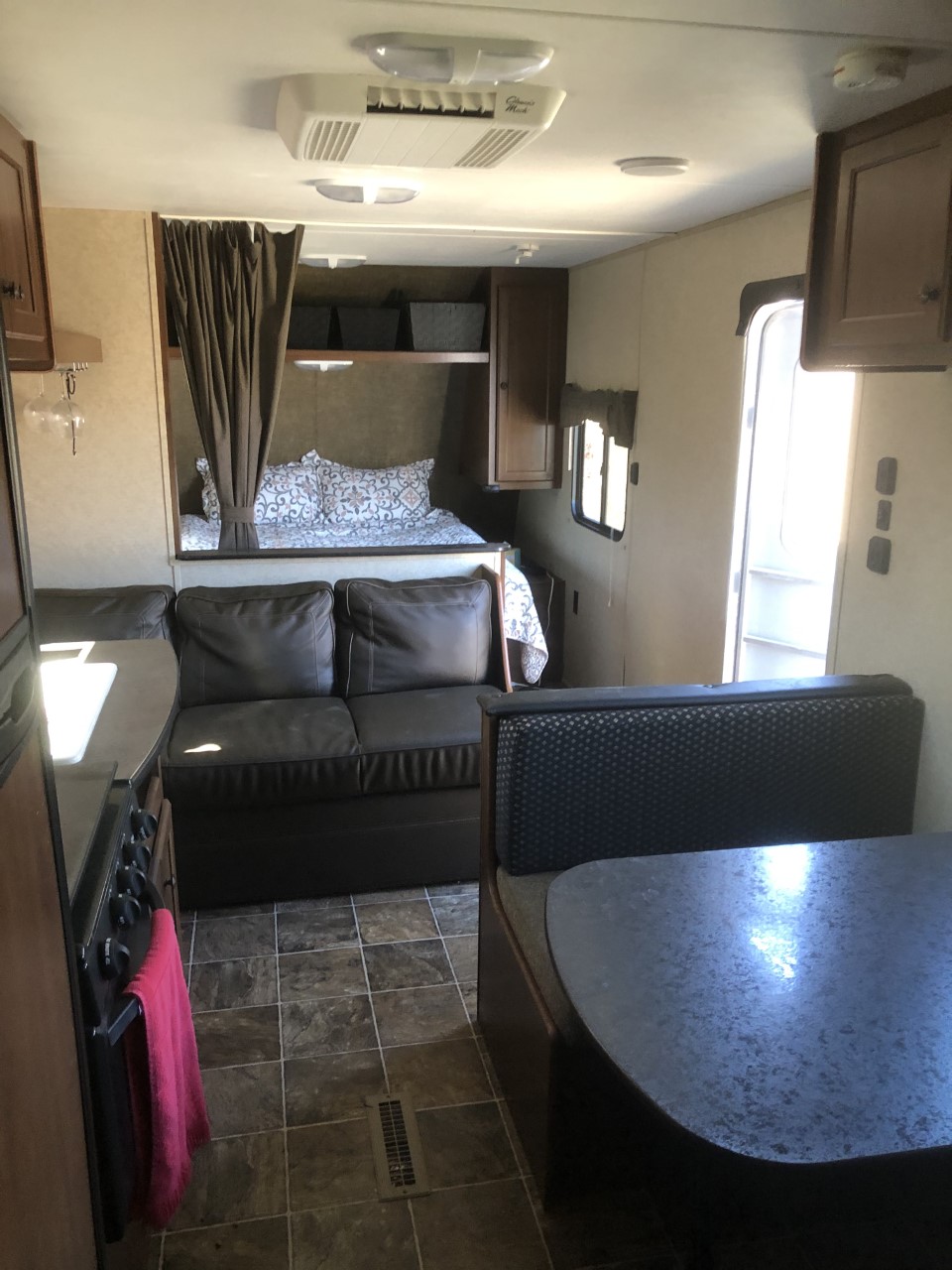 RV rental interior: Bunk bed, kitchen, sofa, and dining booth visible in this travel trailer. Ready for your adventure.. Heartland RVs Prowler Lynx 2016