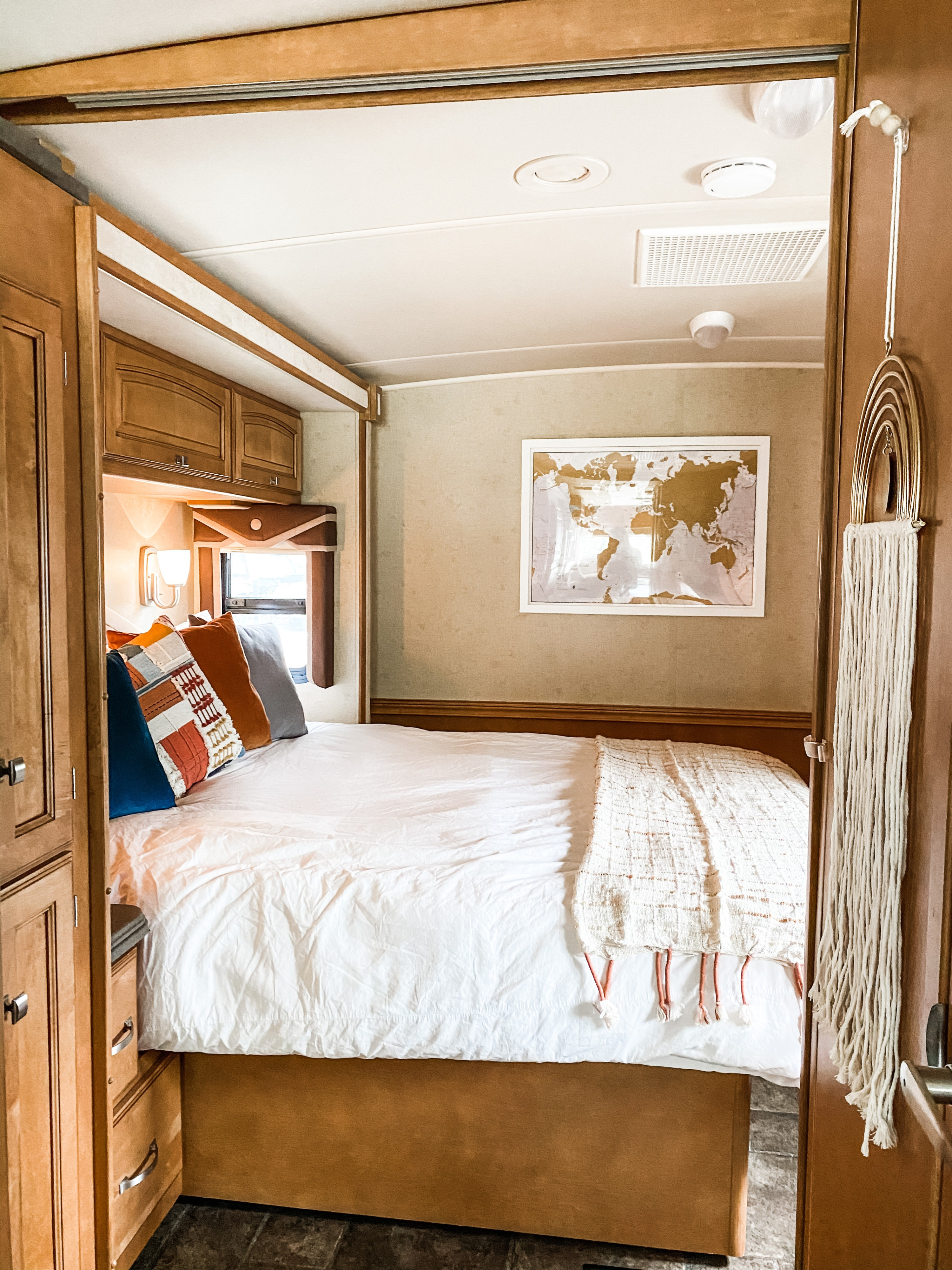 A view of the primary bedroom with queen bed from the kitchen looking in. . Winnebago Sightseer 2013