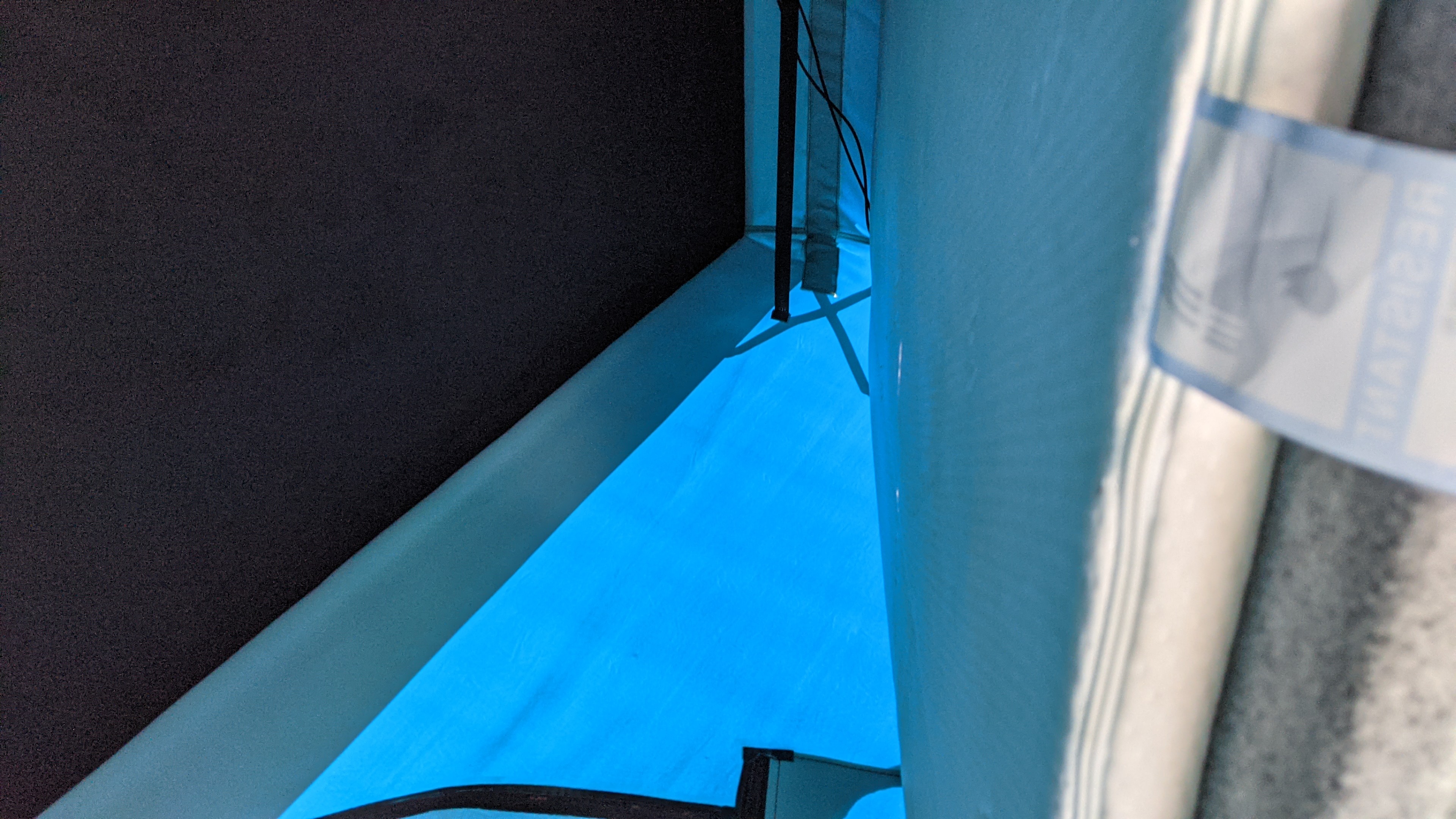 Cozy blue-lit RV rental interior with sleeping area and ambient lighting, perfect for your next camping adventure.. vw T6 2016