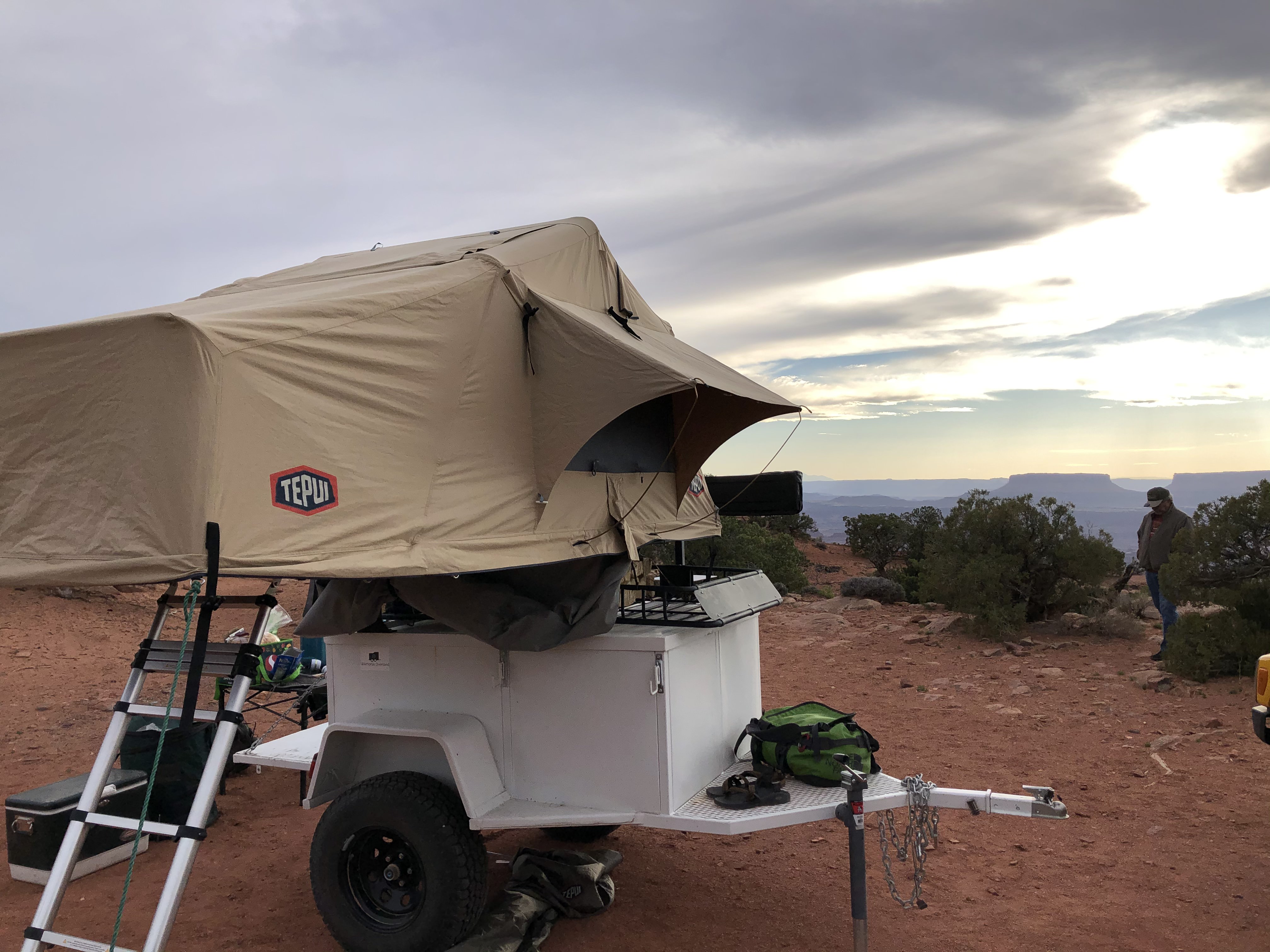 Experience scenic camping with this Tepui rooftop tent on a white overland trailer, a great RV rental option.. Other Other 2020