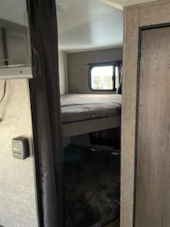 This RV rental features comfortable bunk beds, ready for your family's travel & camping adventures.. Open Range Open Range 2021