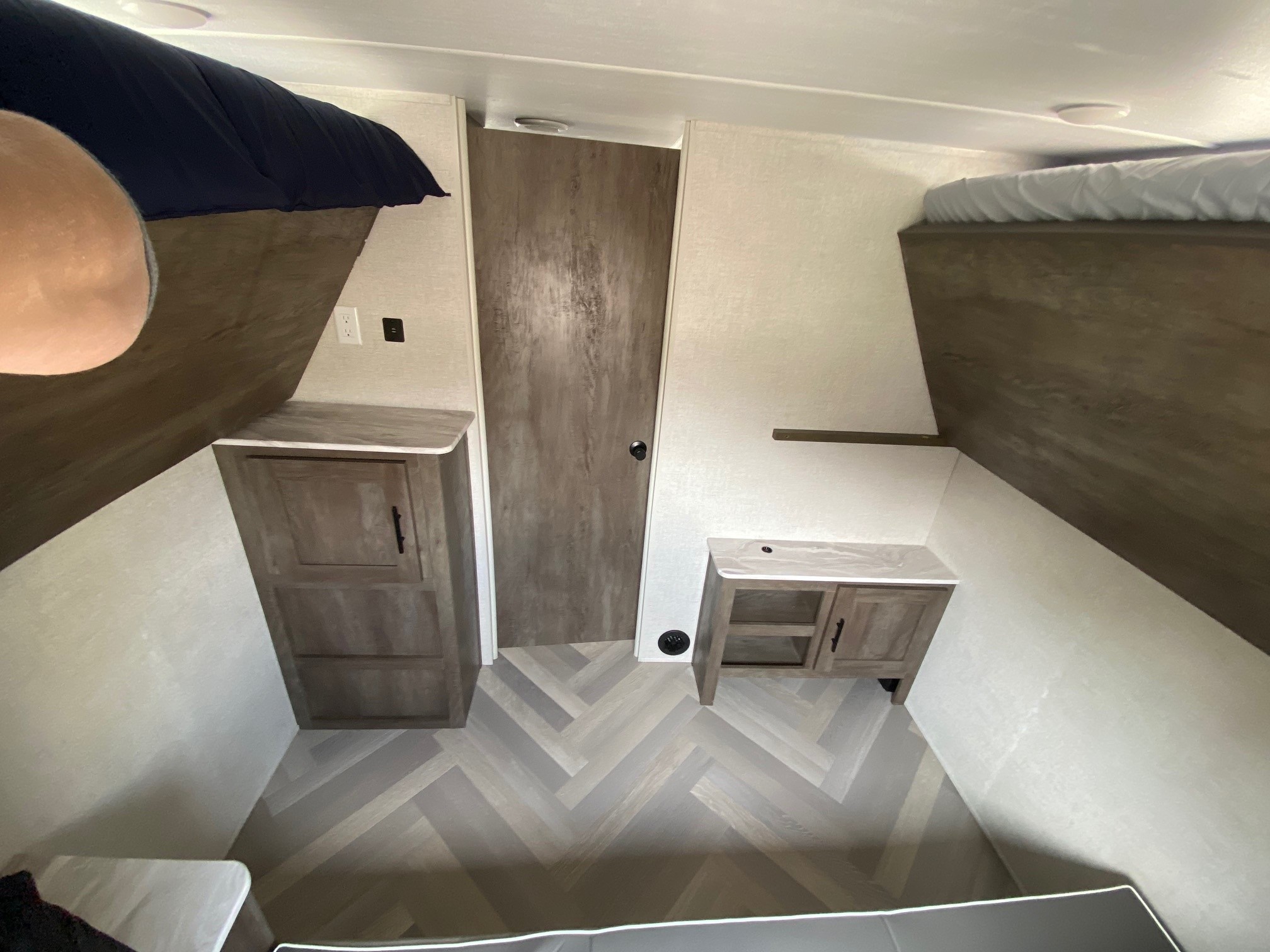 Bunks can be folded up to create playroom space. Forest River Wildwood X-Lite 2021