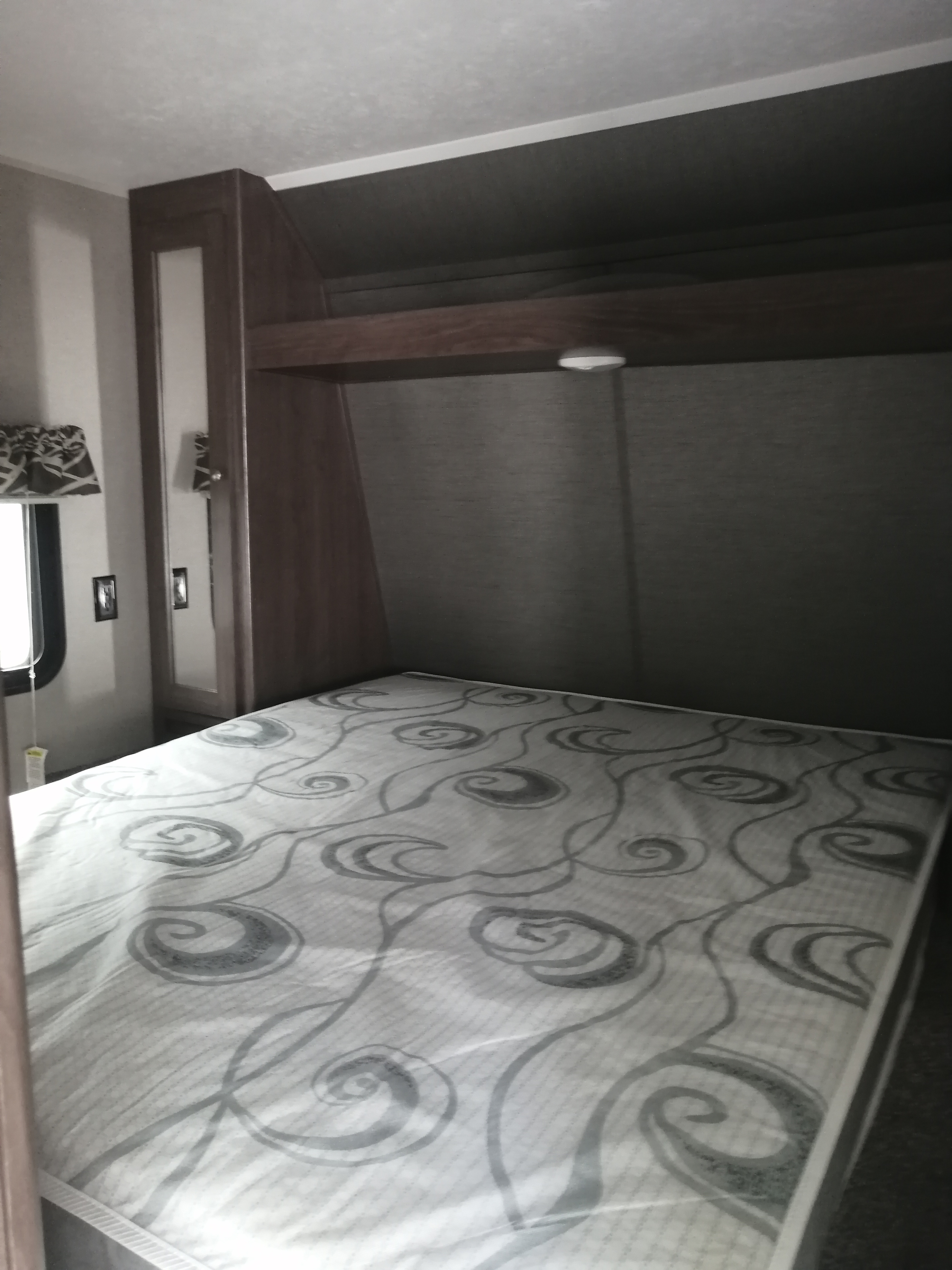 Master bedroom with a queen sized bed. Keystone Hideout 2018