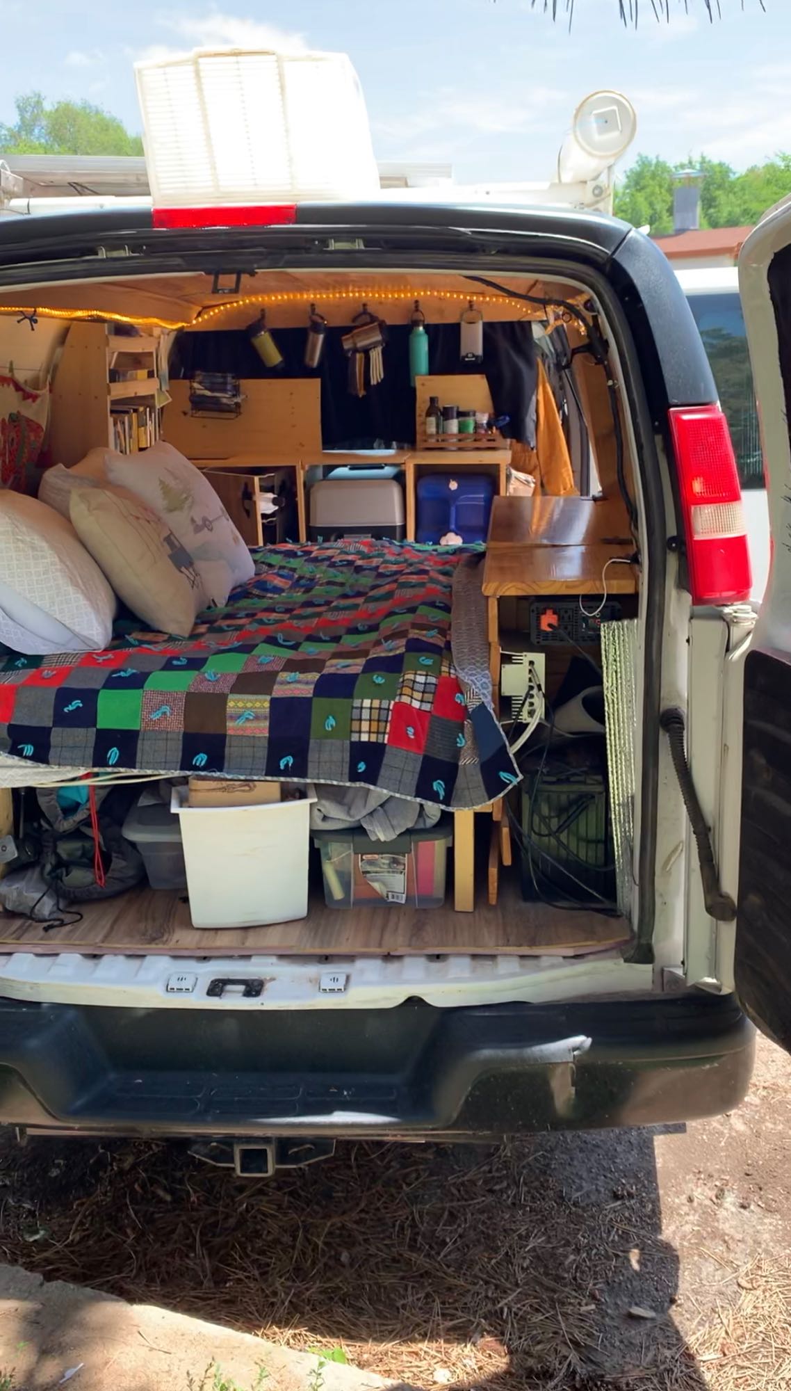Explore this organized camper van interior for your next RV rental adventure. Bed, storage, and amenities for van life.. Chevrolet Other 2013