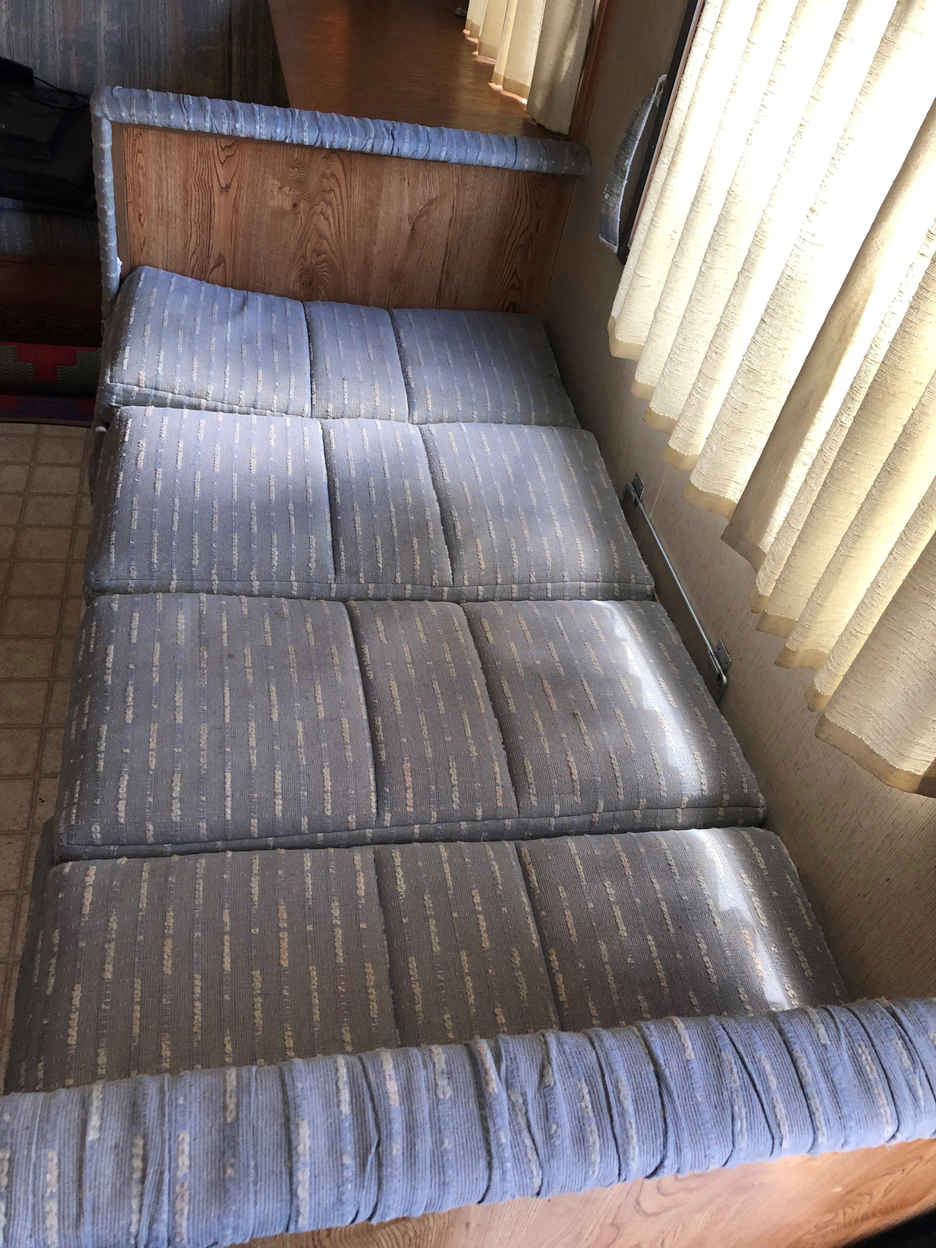 Dining area converts to bed, linens provided. Kit Road Ranger 1990