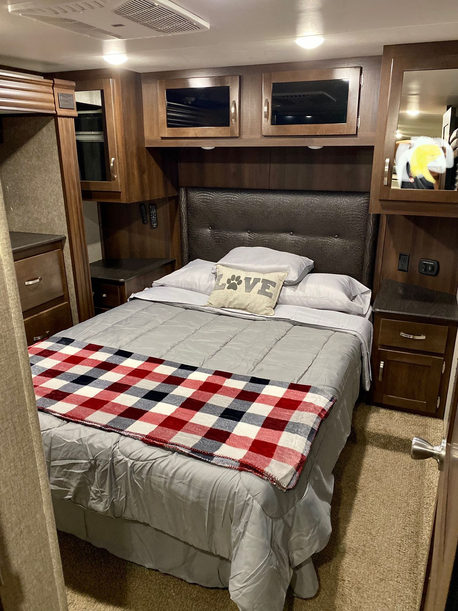 Comfortable RV rental bedroom with spacious bed, ample storage, and cozy decor. Perfect for travel!. Jayco Talon 2019