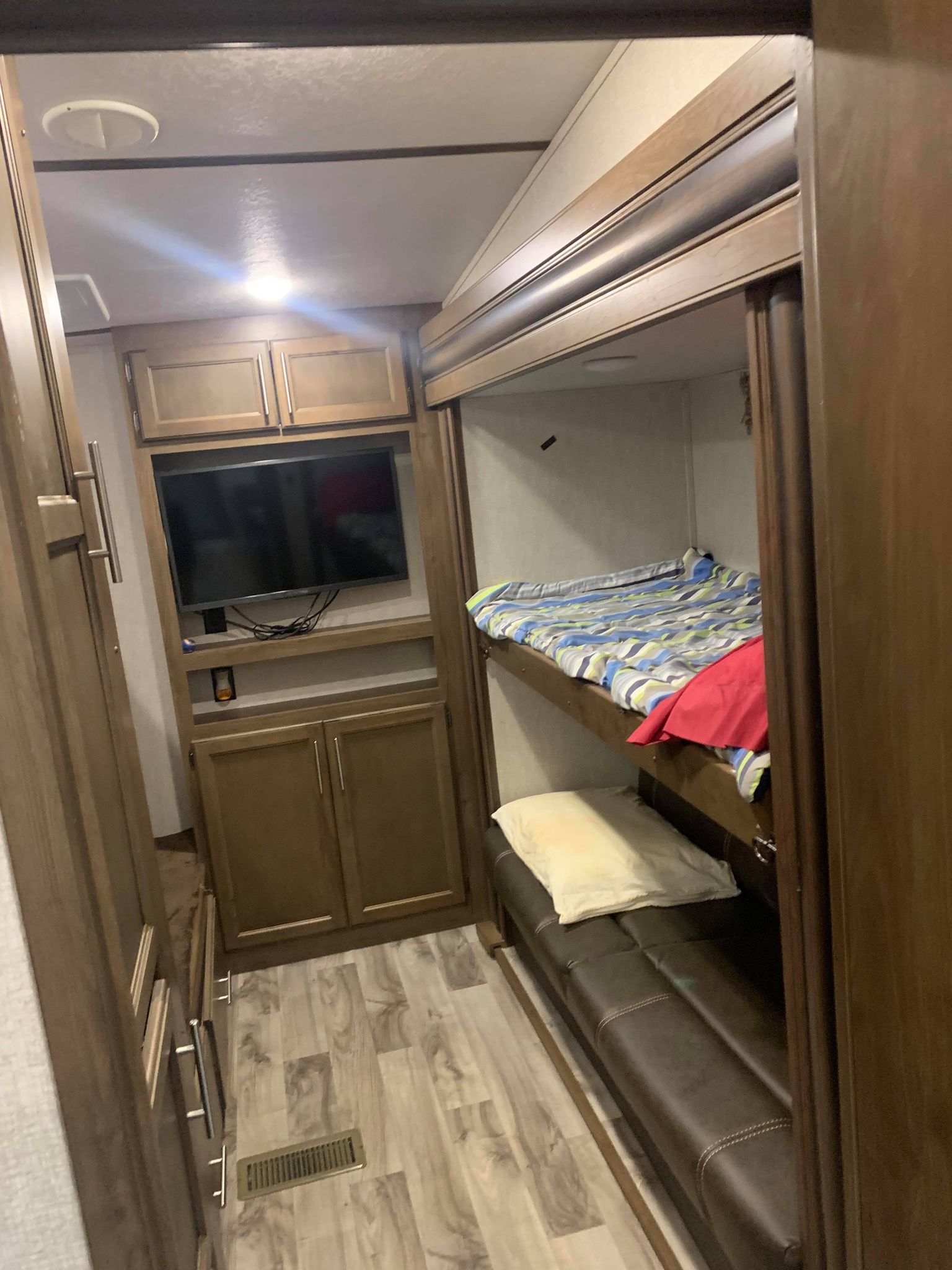 Bunkroom with 2 sets of bunks and a TV.. Keystone Cougar Half-Ton 2019