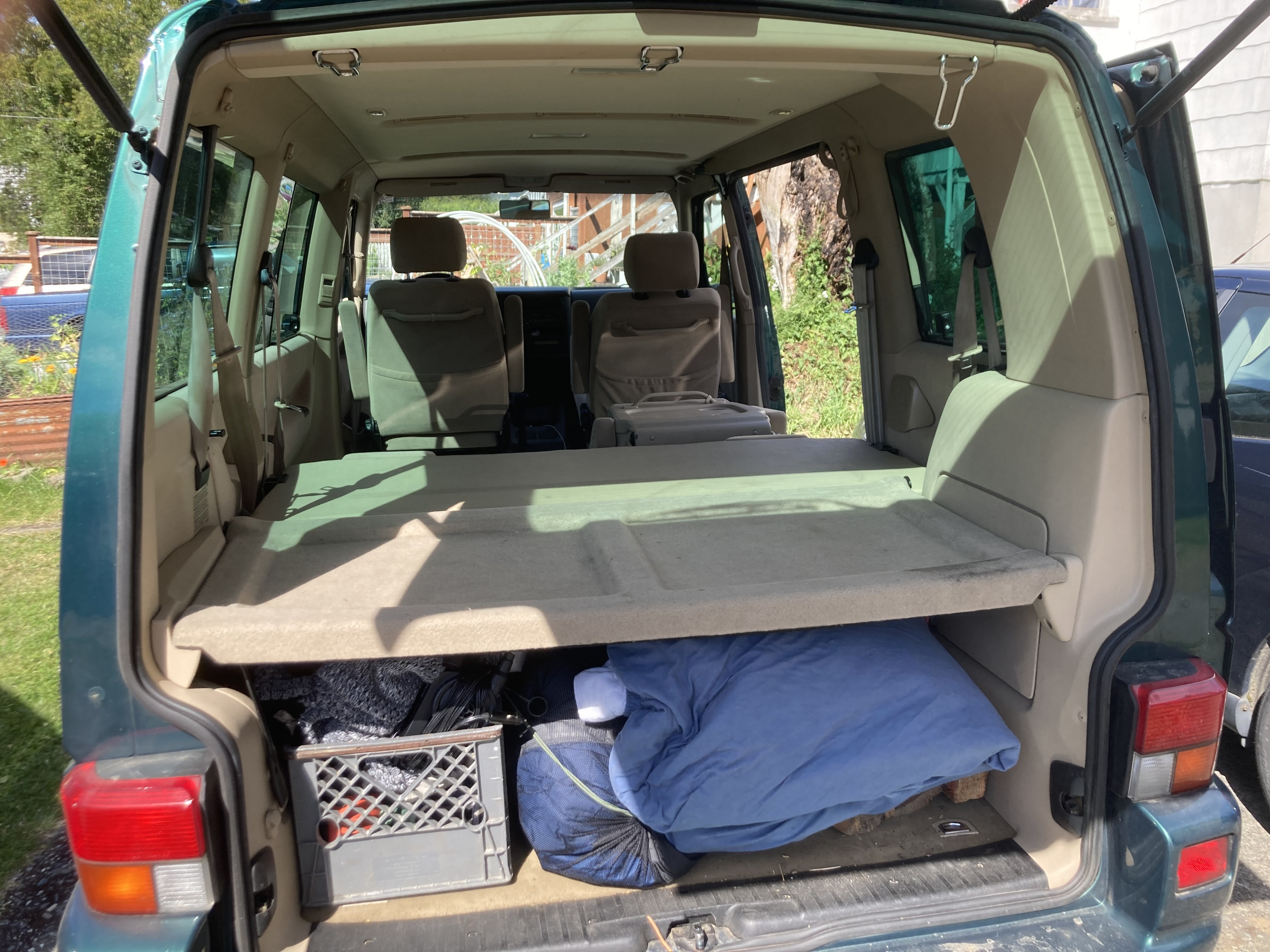 The back bench seat folds down leaving you with the flat space to put the mattress down and still plenty of storage underneath. Volkswagen T4 Transporter 2001