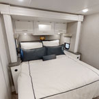 This inviting RV rental bedroom offers a comfortable queen bed, ample storage, and modern decor for your travel adventures.. Coachmen Mirada A-Class 2022