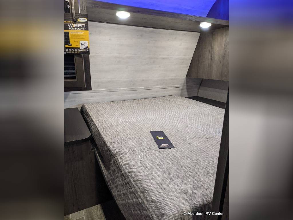 RV rental bedroom with comfortable bed, overhead lights & storage, plus solar wiring. Ready for adventure!. Jayco Jay Flight 2021