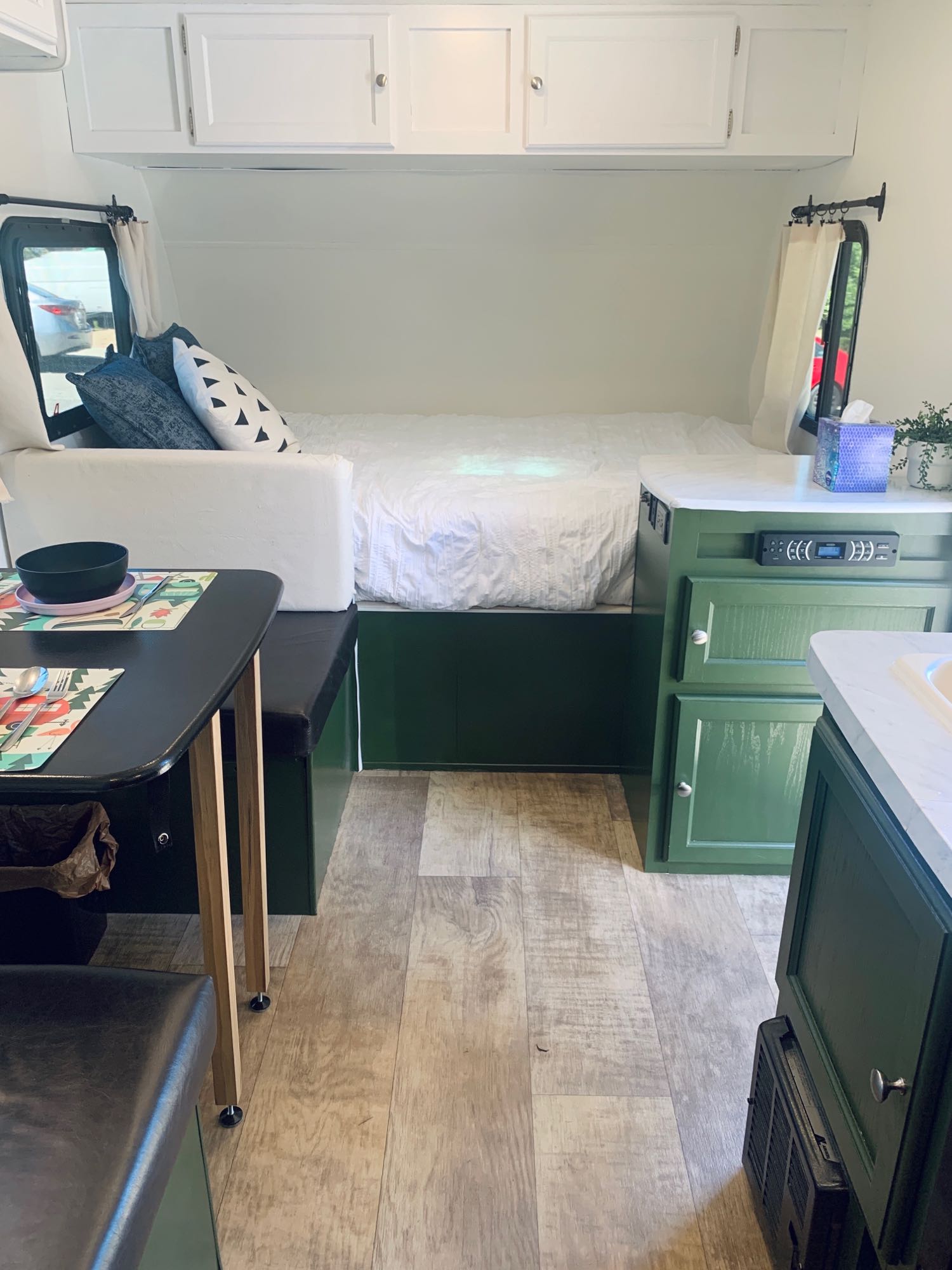 This rv rental offers a comfy bed, dining area, and green cabinets, all within a bright, modern interior.. Palomino Palomini 2016