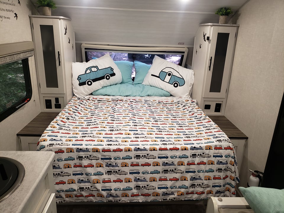 RV rental: Cozy bedroom with car & camper bedding, built-in storage, window view, and fire extinguisher.. Forest River R-Pod 2022