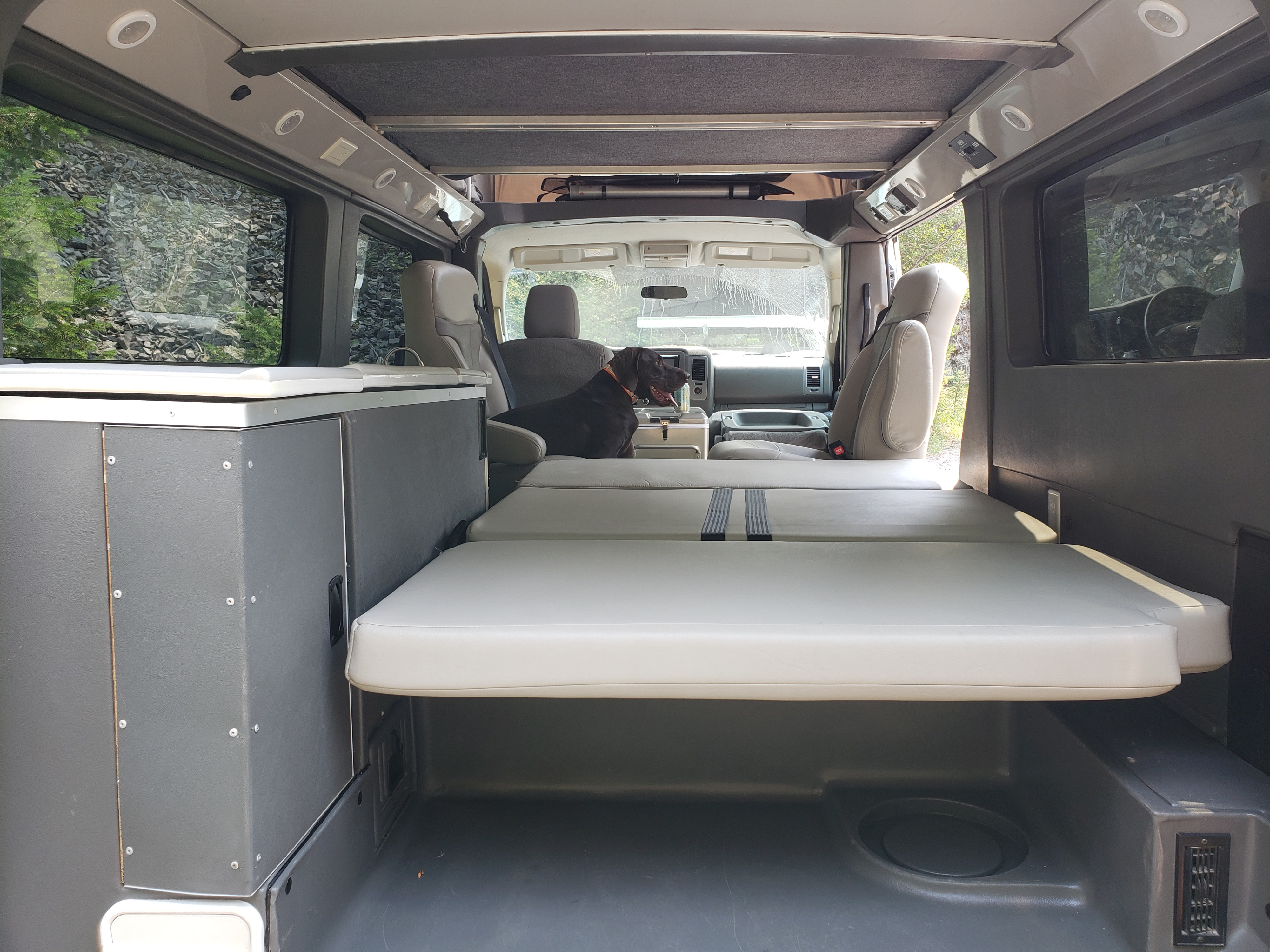 View inside an RV rental. A brown dog sits near the. Roadtrek N6-Active 2012