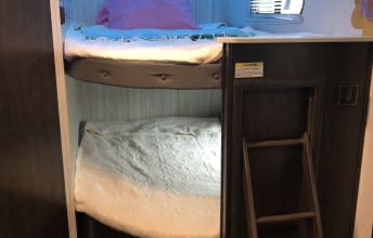 This RV rental features comfortable bunk beds with a ladder. The top bunk has a pillow, the lower a blanket, perfect for travel.. Heartland Pioneer 2020