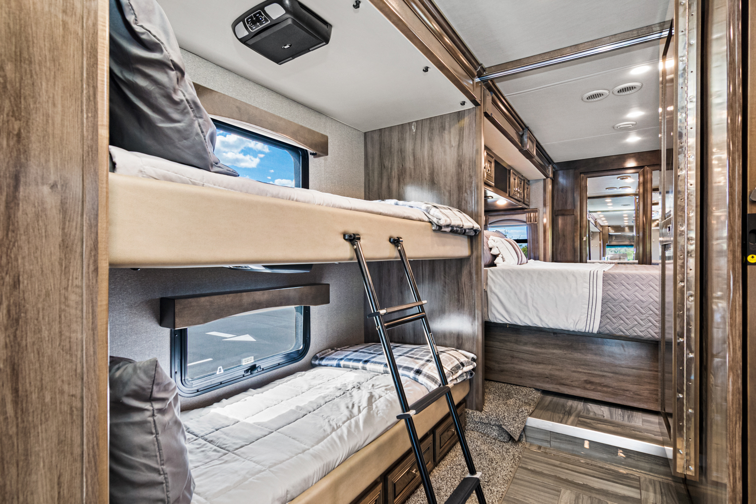 Experience comfort in this RV rental's spacious interior, featuring cozy bunk beds and a separate master suite.. Fleetwood Discovery LXE 2020