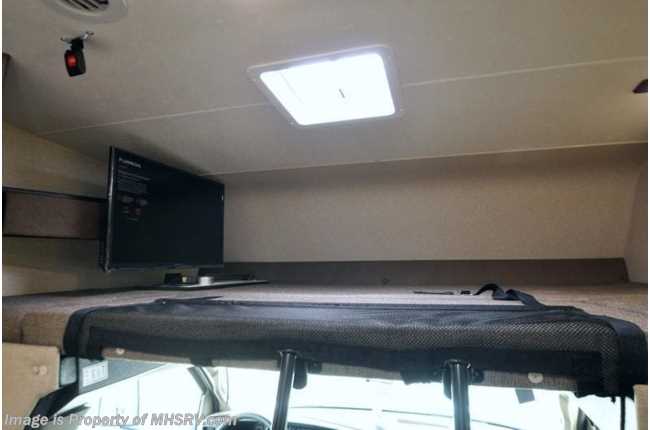 RV rental interior: Cab-over bunk features TV, ceiling skylight, and front safety net.. Chevrolet Other 2020