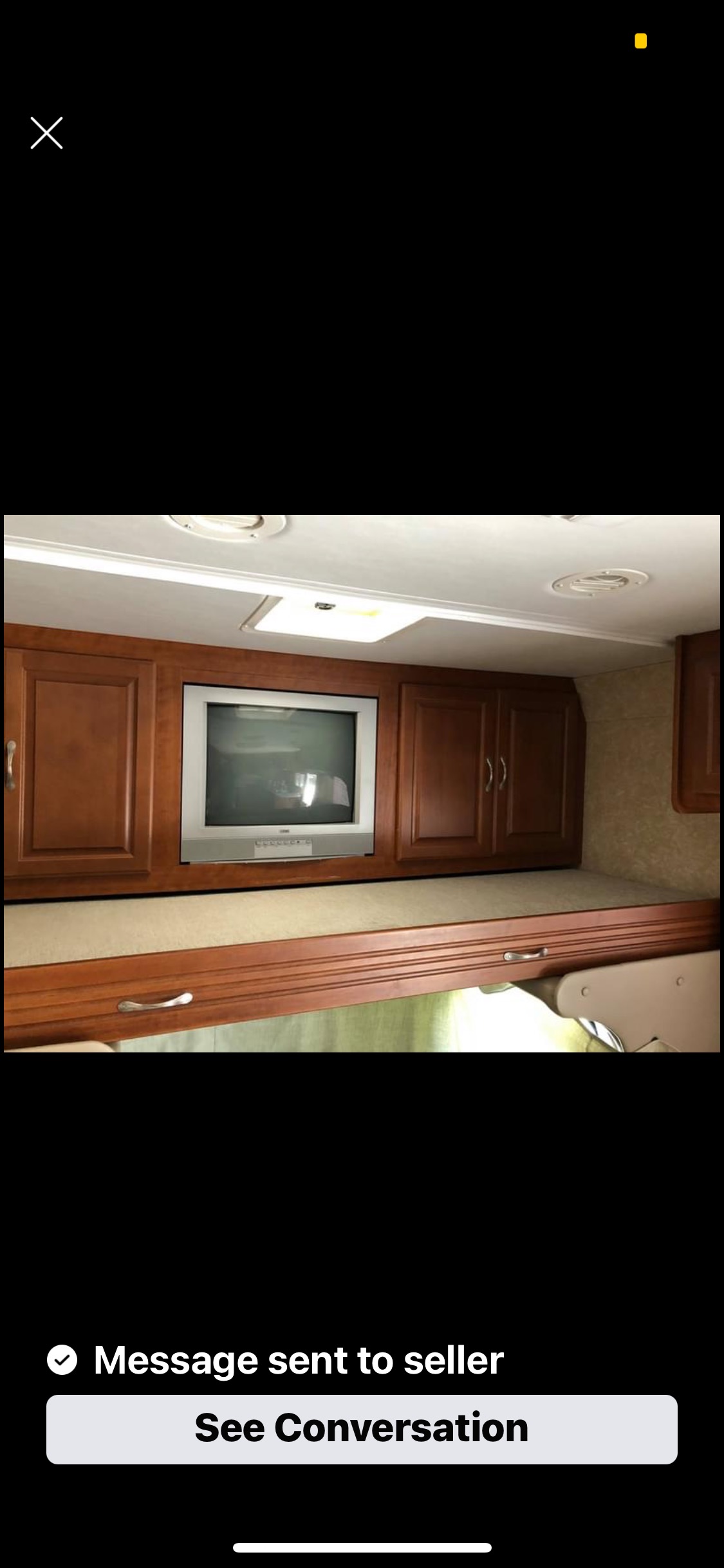 RV rental interior: compact entertainment center with classic TV, extensive wooden cabinets & upper ventilation. Ready for trips!. Dutchmen Dutchmen 2008