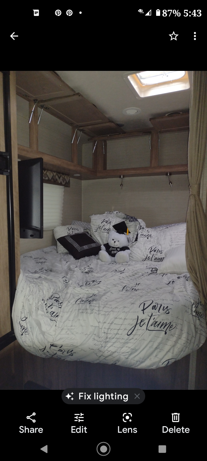 Cozy RV rental bedroom with "Paris je t'aime" bedding and a "Class of 2021" teddy bear.. Jayco Redhawk SE 2020