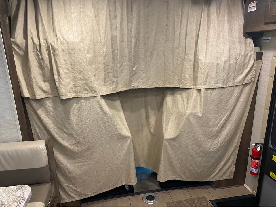Curtains across bunk and cab area allow for privacy.. Jayco Melbourne 2019