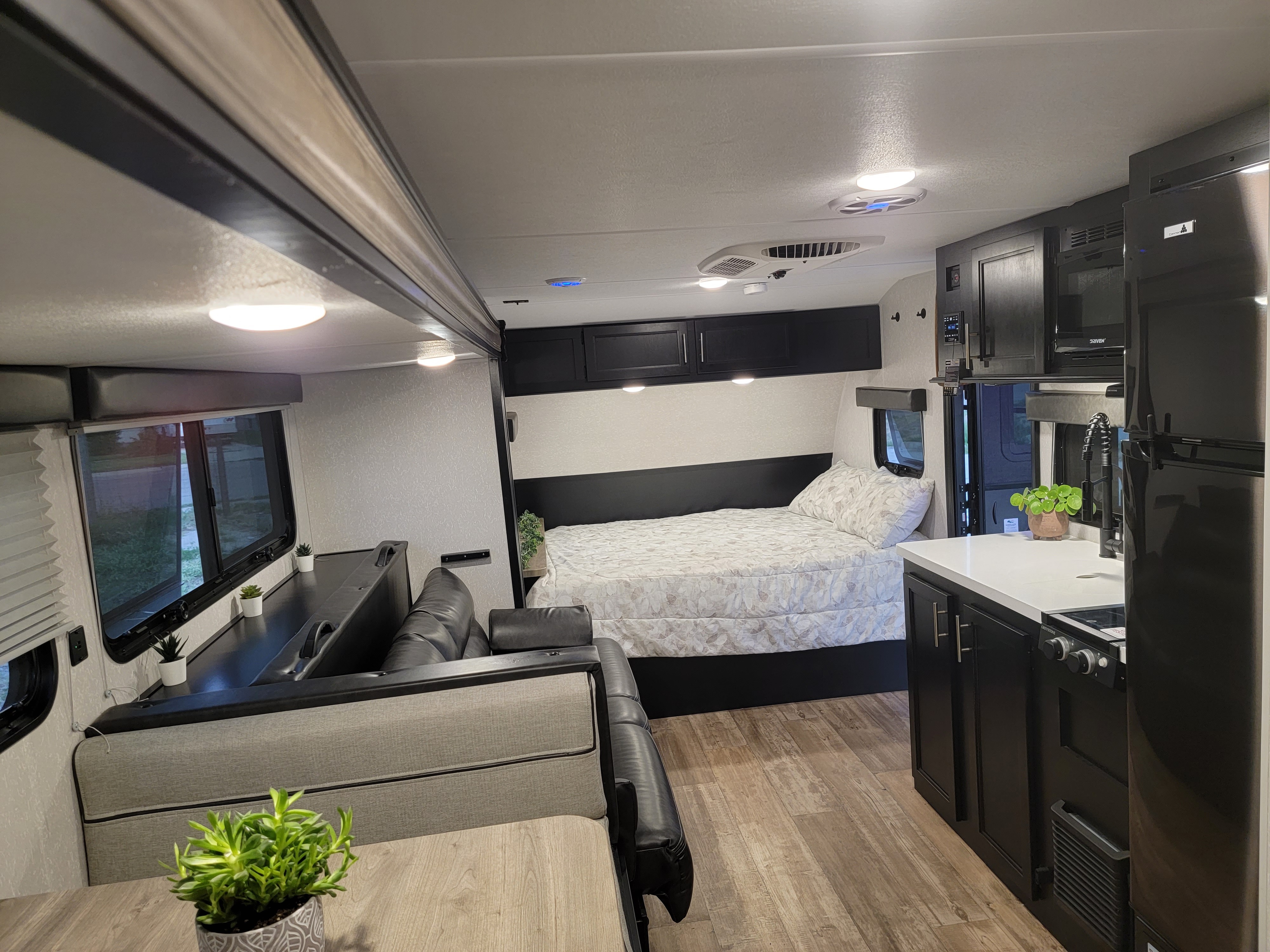 Experience comfort in this modern rv rental, featuring a full bed, kitchen, and living area for your next adventure.. Forest River Cherokee Wolf Pup 2021