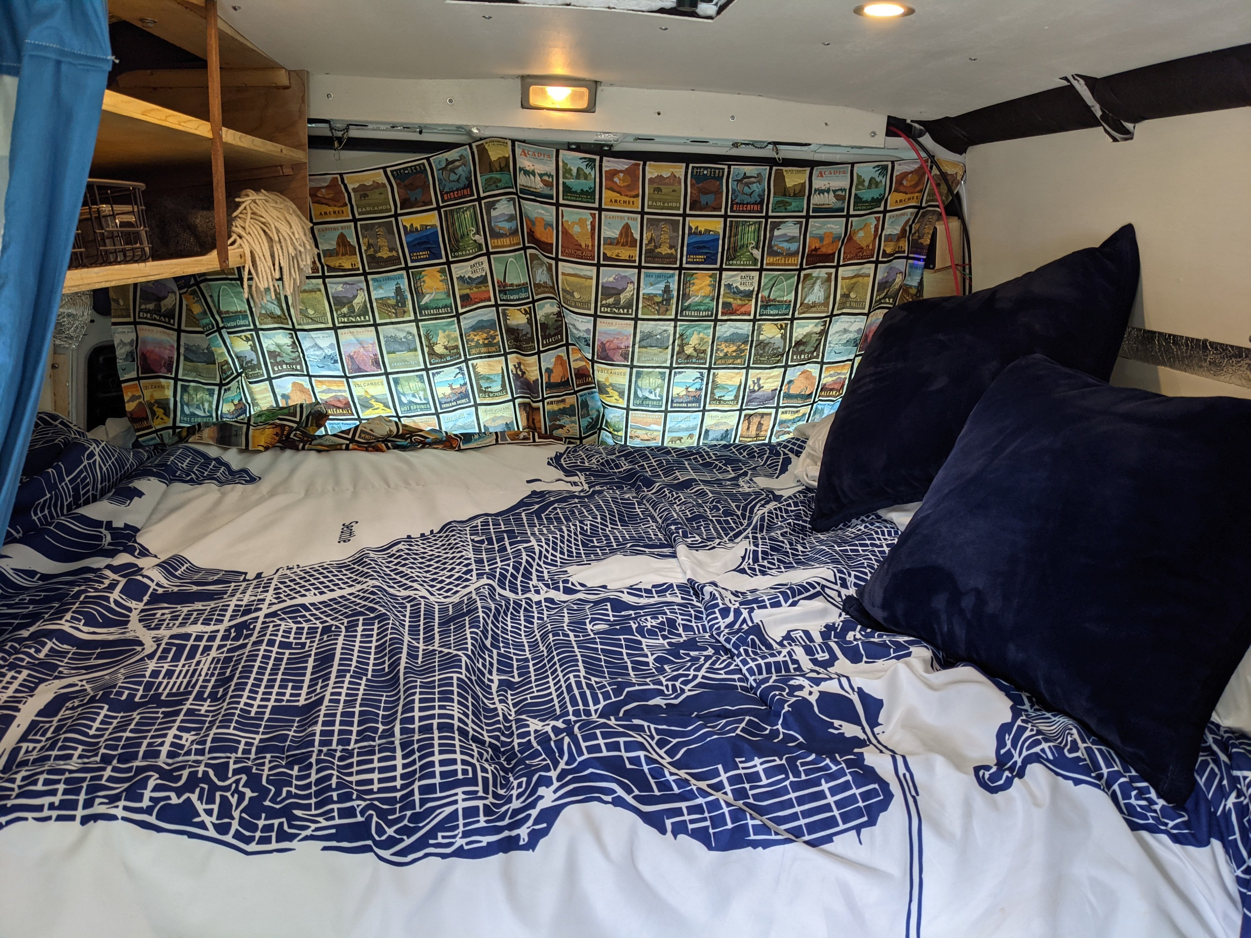 Comfy tempur-pedic topper, chargers, and cup/phone shelves.. RAM Promaster 2015