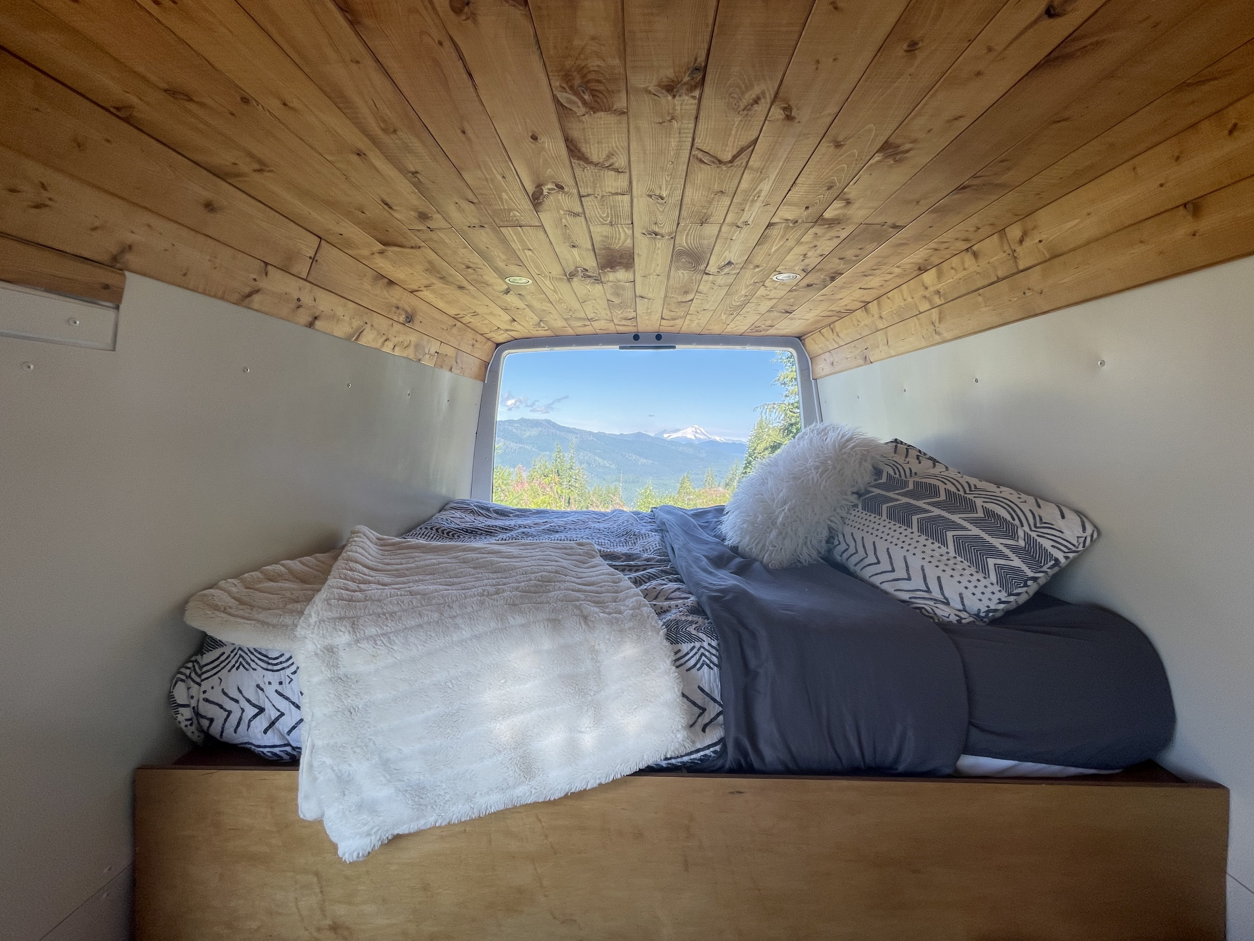 Our comfy bed with the back doors open to enjoy the views.. Dodge Sprinter 2005