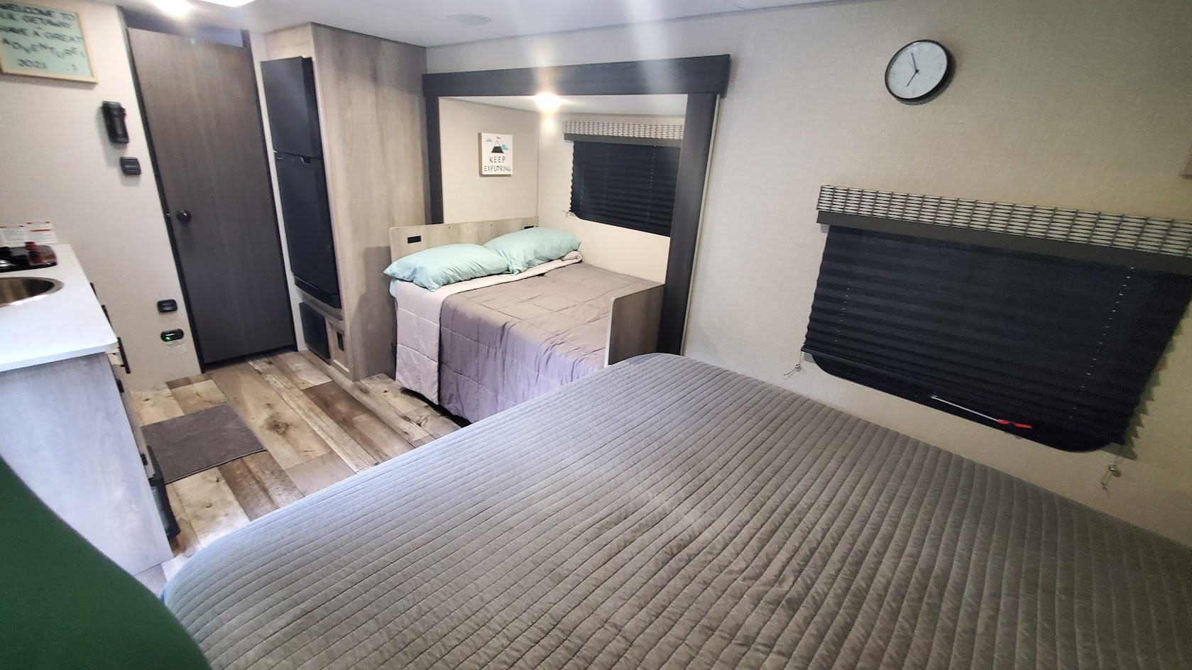 Tour this RV rental's versatile interior: main bed, bunk beds, compact kitchen, and storage for your adventures.. Other Other 2021
