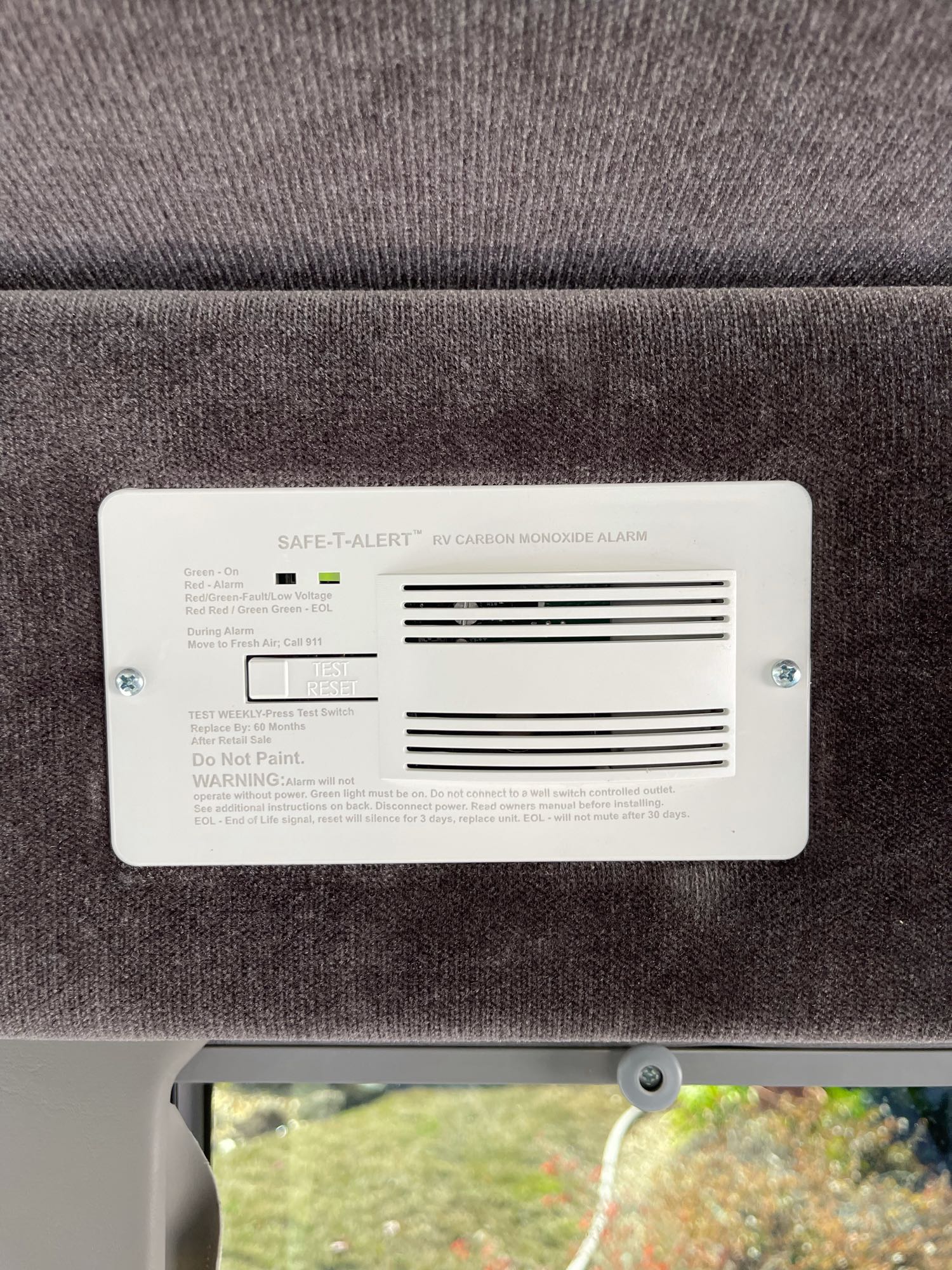 An RV carbon monoxide alarm, a crucial safety feature in an RV rental, ensuring peace of mind on the road.. Sportsmobile Custom Design 2013