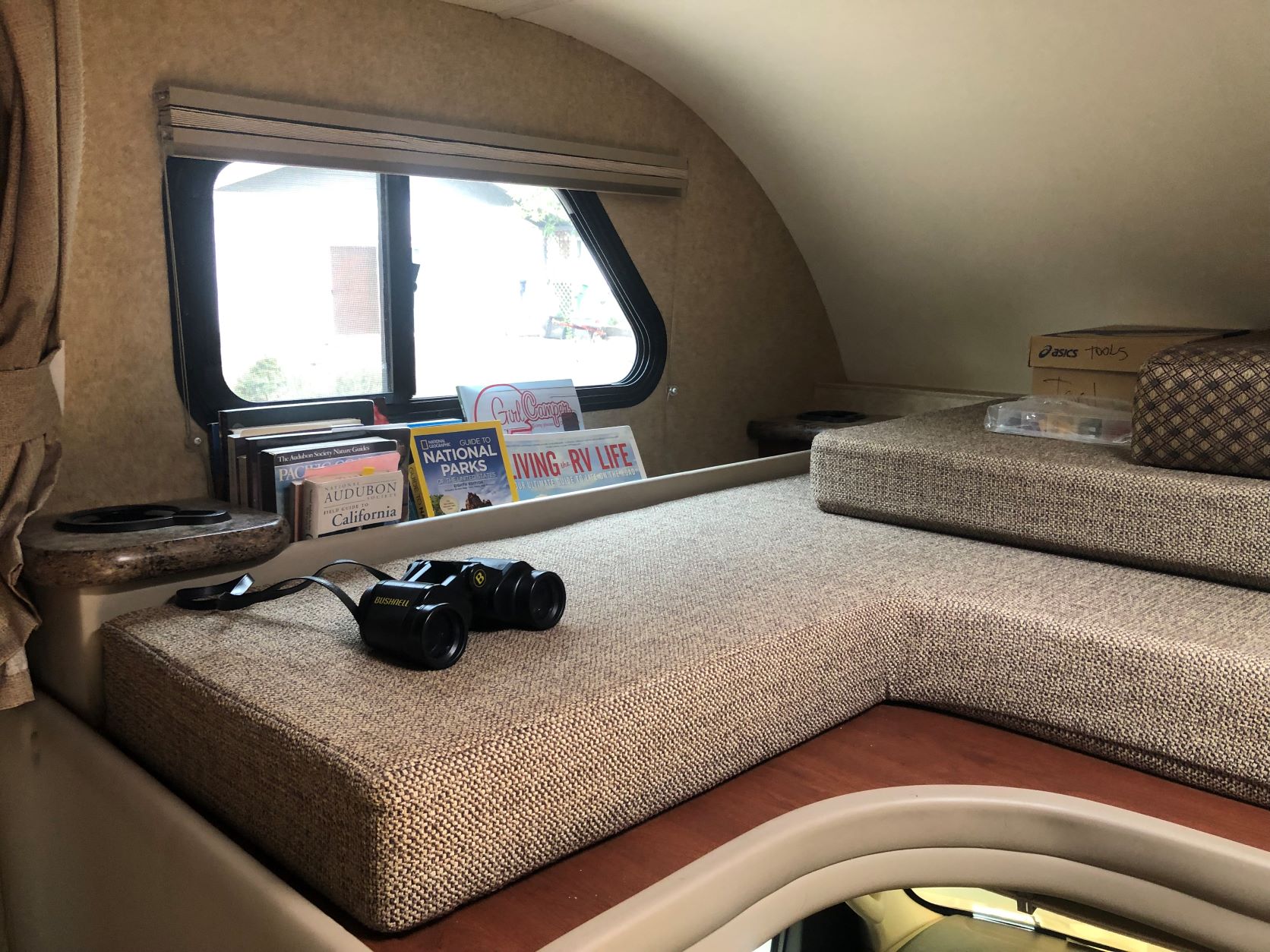 Included are some travel/camping books and binoculars!. Thor Four Winds 2016